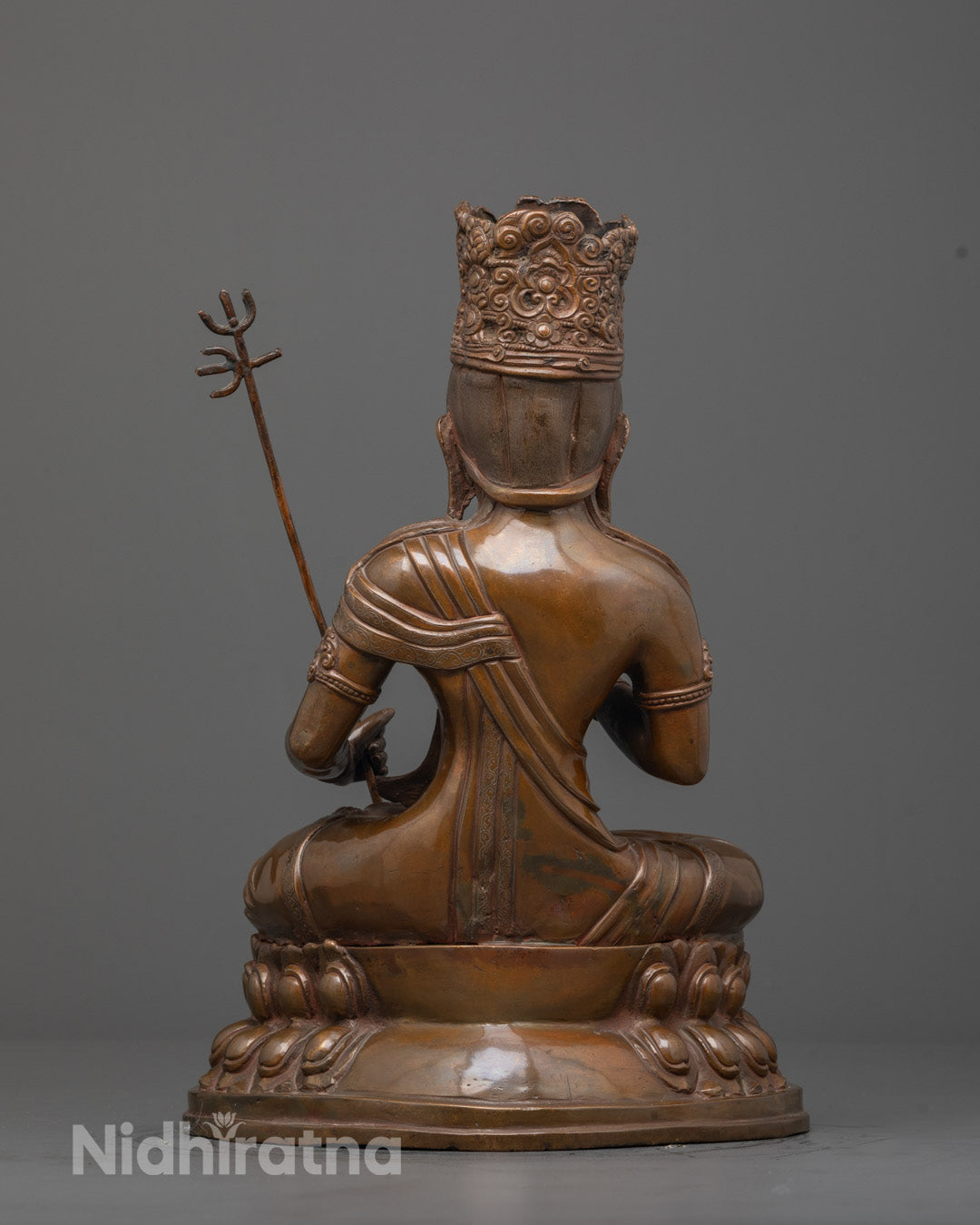 Back view of oxidized Akasagarbha statue highlighting detailed garments and craftsmanship