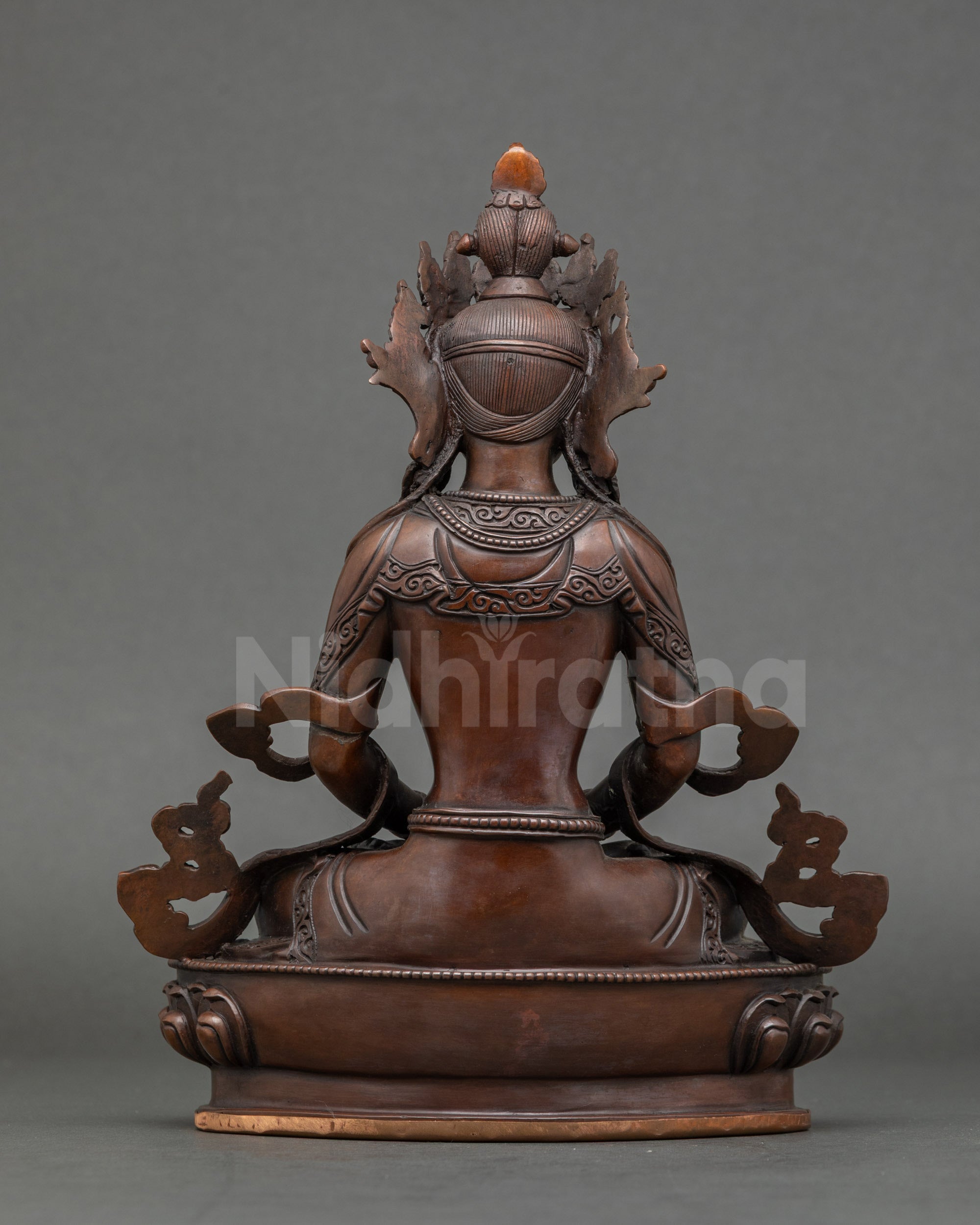 Back view of oxidized Amitayus statue showing lotus throne and intricate Himalayan craftsmanship