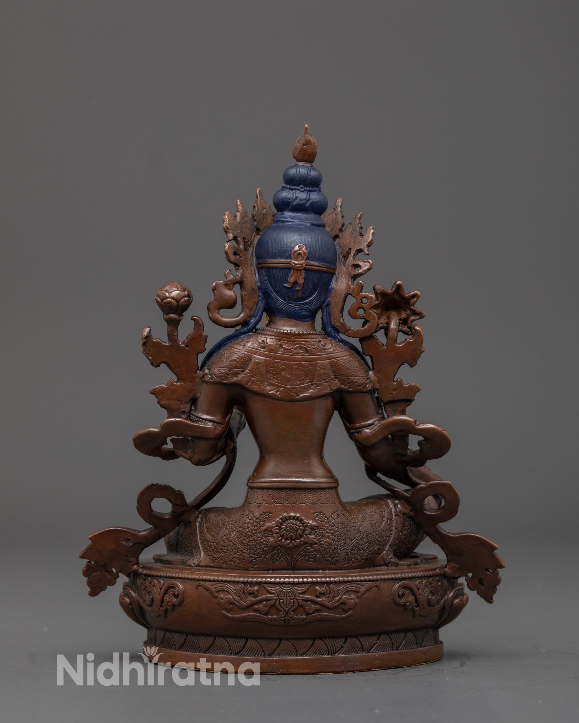 Back view of oxidized Green Tara statue highlighting intricate carvings and artisan finish