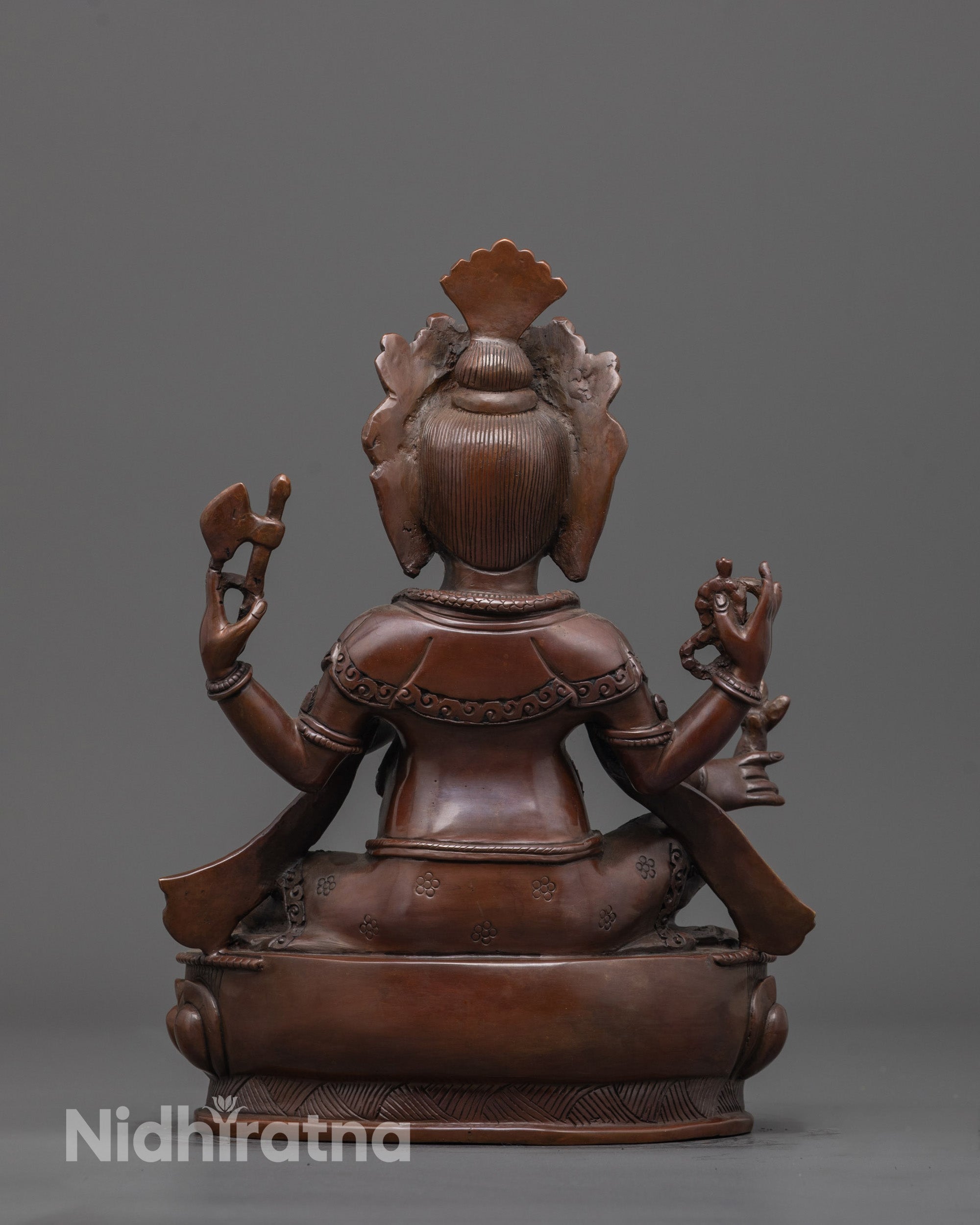 Back view of oxidized Lord Ganesha statue displaying detailed crown and lotus seat craftsmanship.