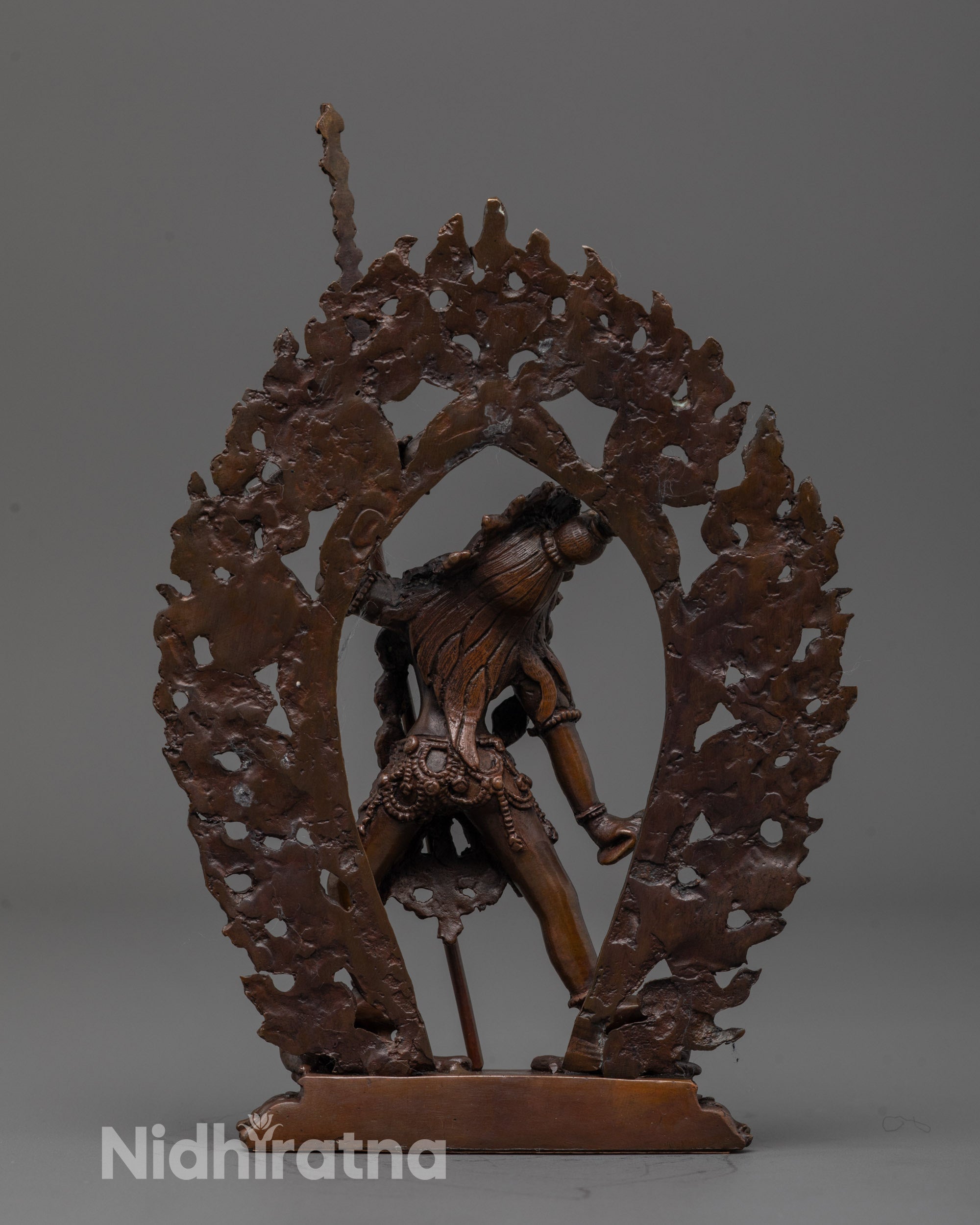 Back view of oxidized Vajrayogini statue highlighting flowing robes and craftsmanship details
