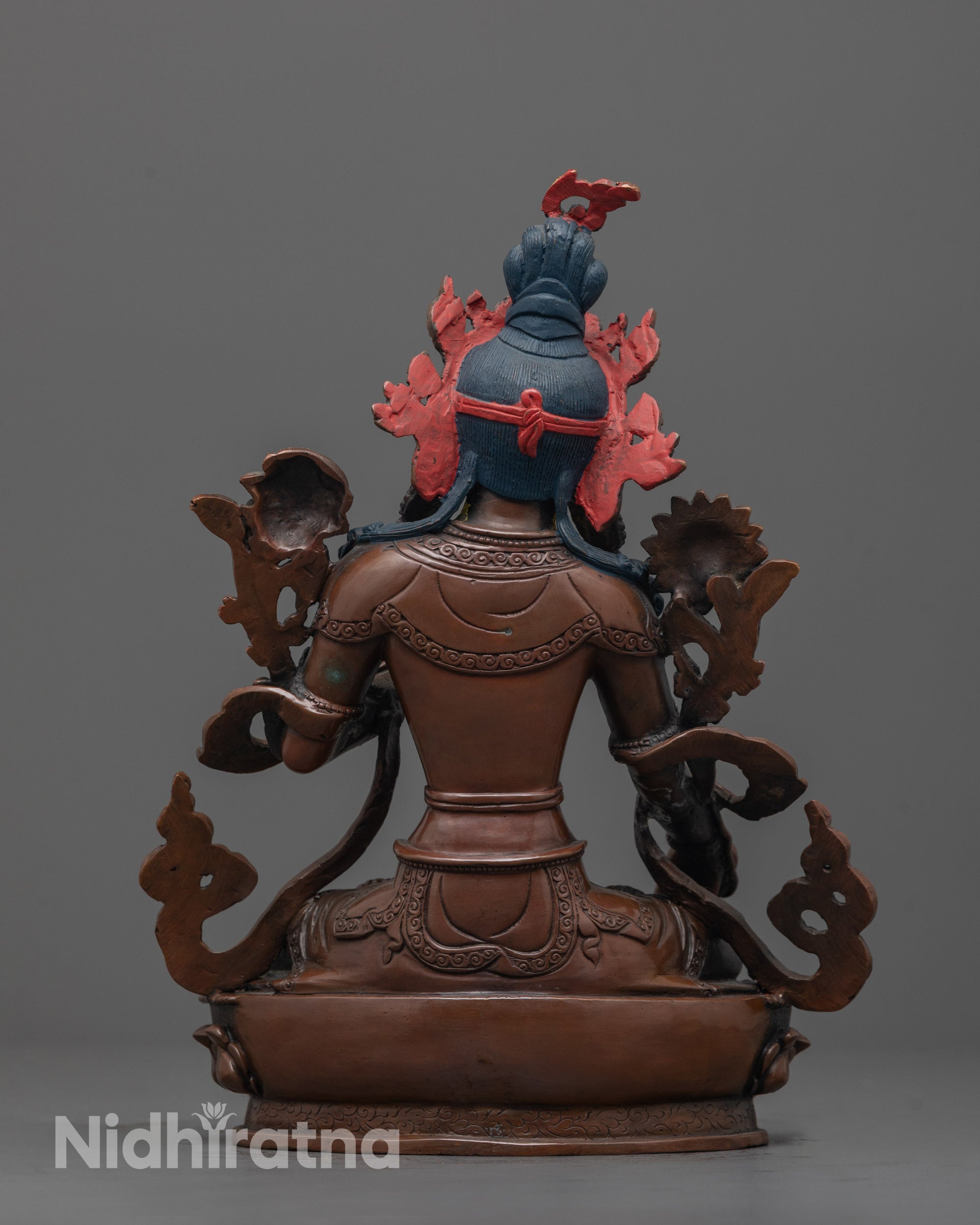 Back view of oxidized copper White Tara Statue with detailed lotus seat and flowing robe