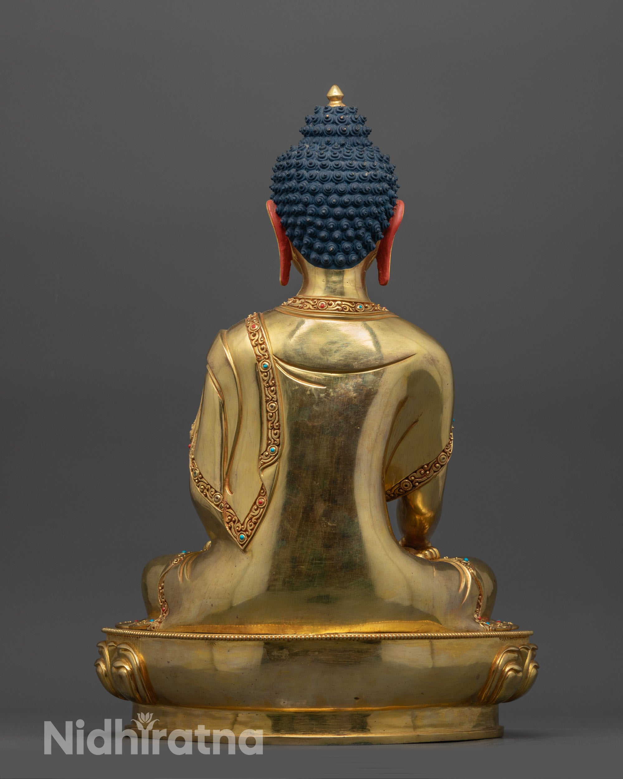 Back view of premium Shakyamuni Buddha statue highlighting detailed craftsmanship and gold fire gilding