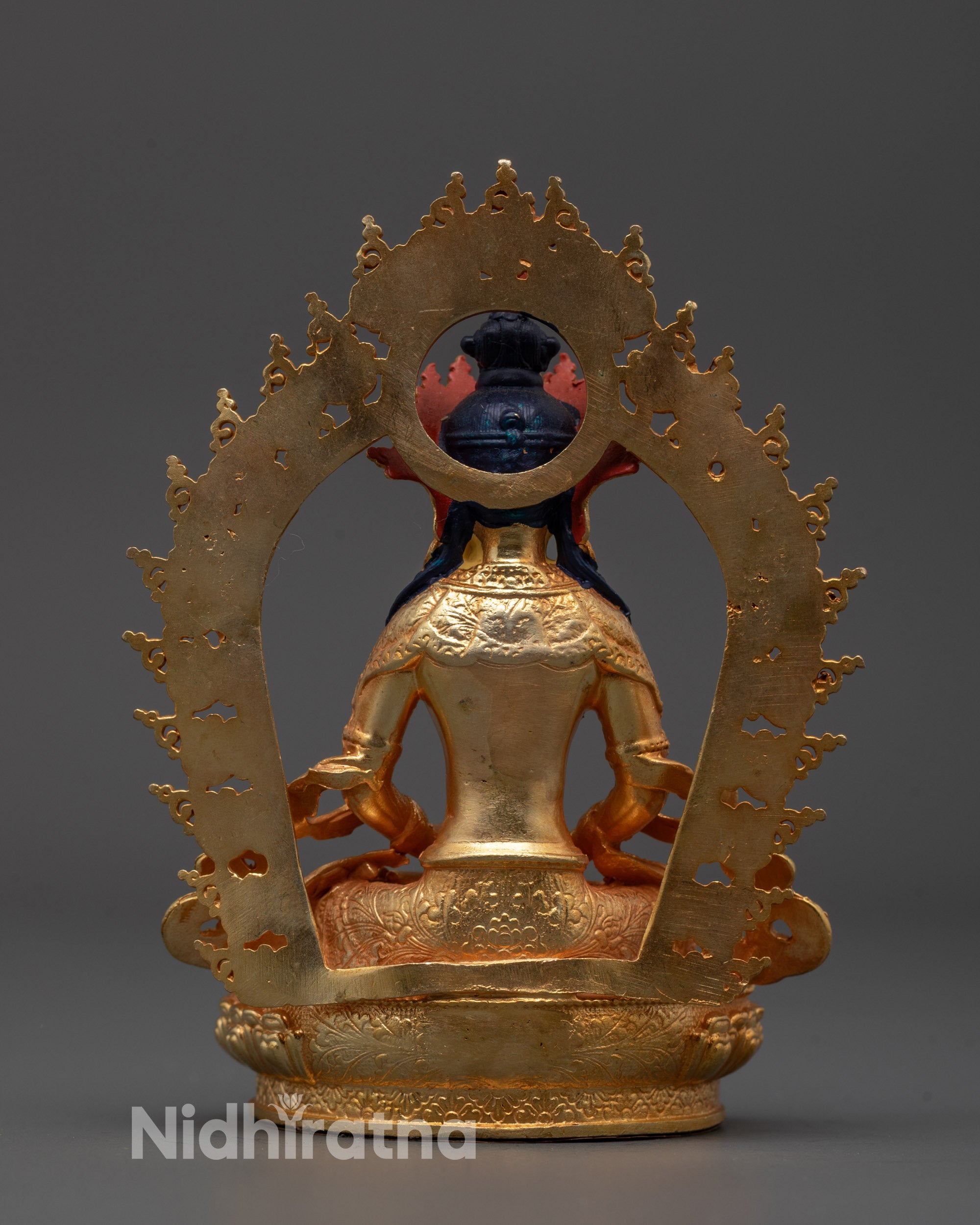 Back view of the Amitayus Buddha statue showing the intricate halo design