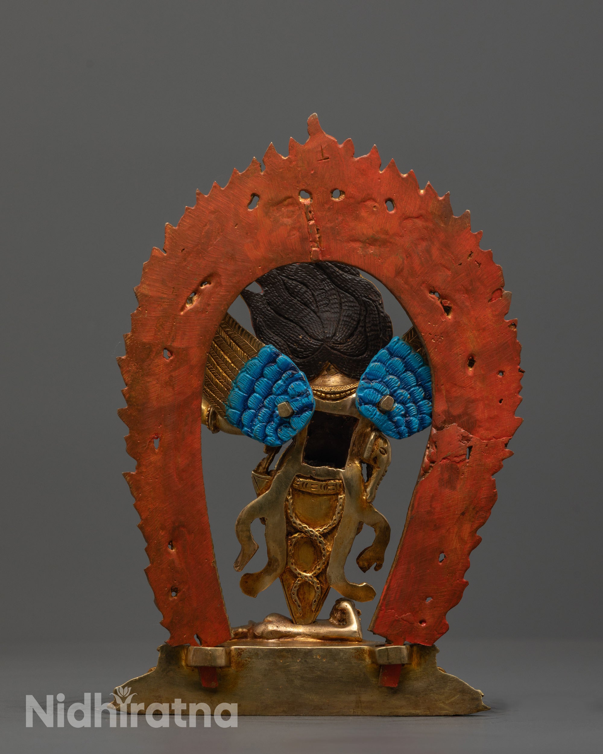 Back view of the Dorje Phurba Statue revealing elaborate robe patterns and copper texture