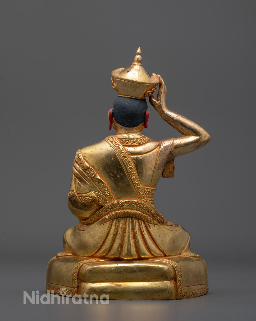 Back view of the sleeping Karmapa Buddha Statue highlighting oxidized copper