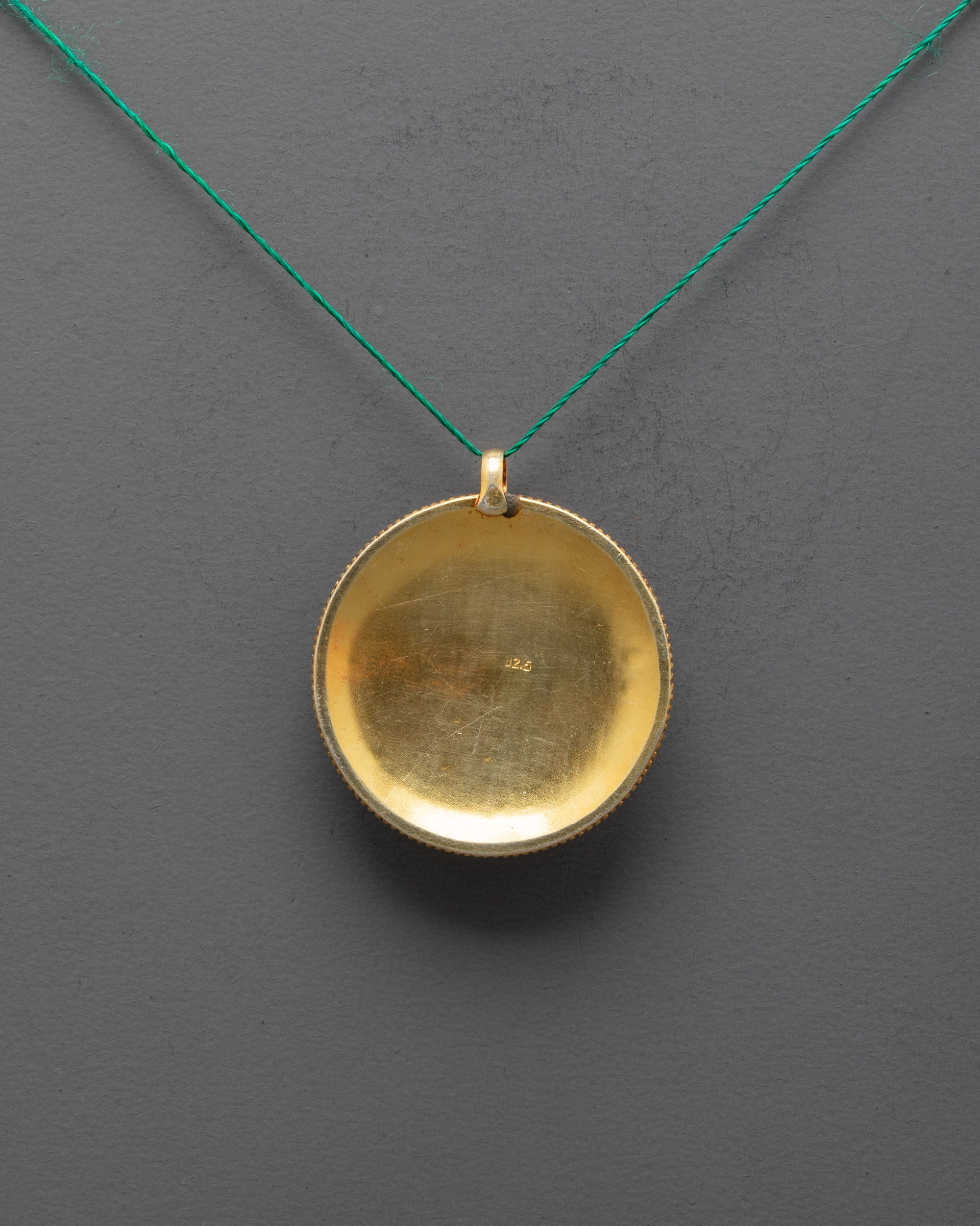 Back view of traditional Nepalese Flower Locket showing detailed craftsmanship and finish