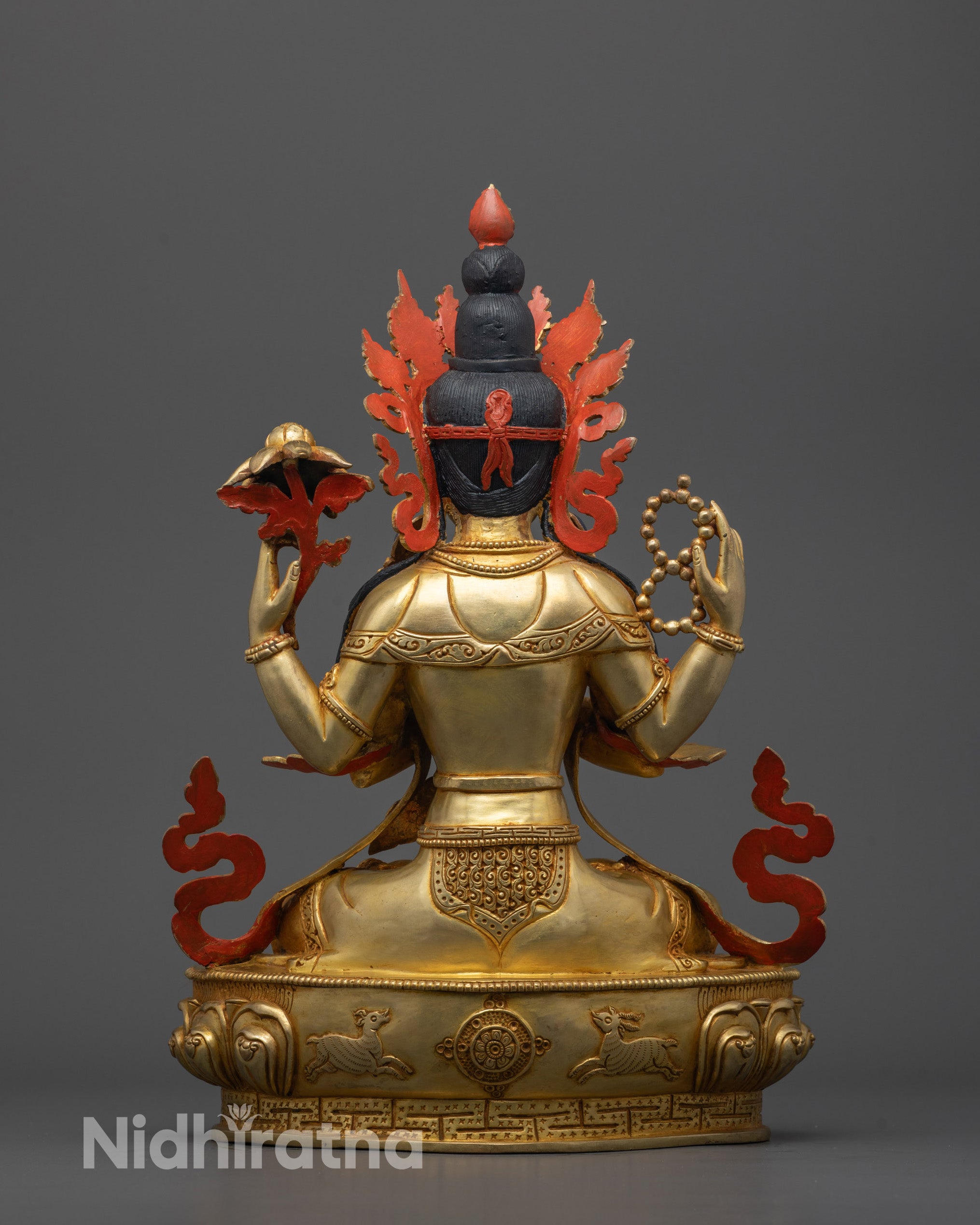 Back view of traditional copper Chenrezig Statue highlighting hollow consecration chamber