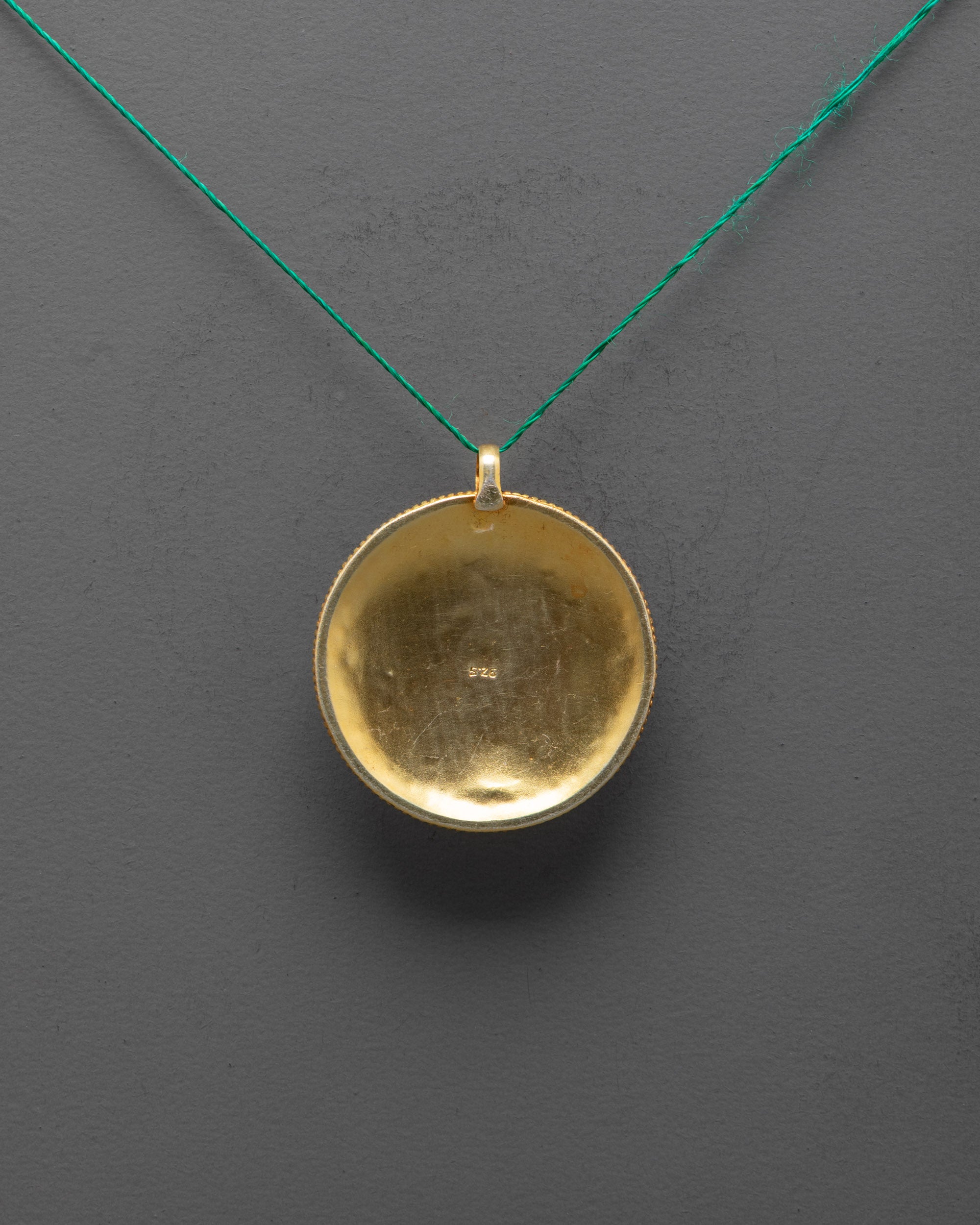 Back view of traditional handcrafted Flower Locket showing detailed artistry