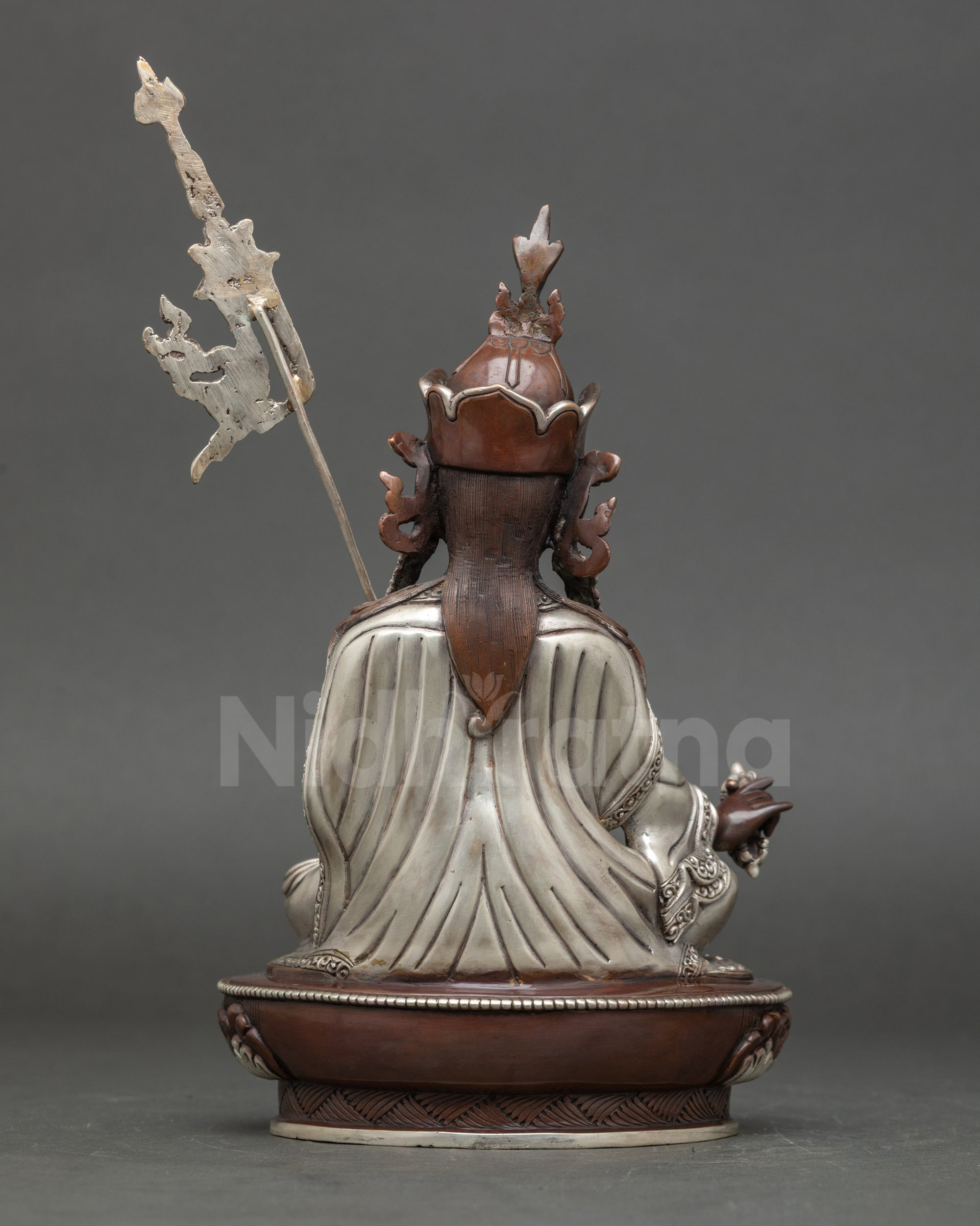Back view oxidized Guru Rinpoche statue displaying lotus seat and robe detailing