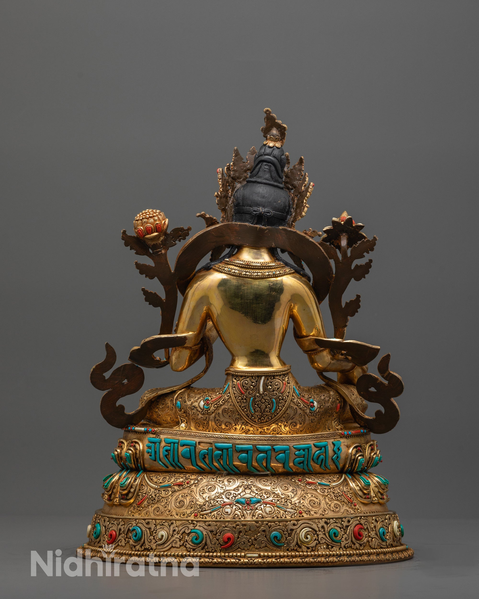 Back view showing hand-carved mantra and unique gemstone pattern on Green Tara’s throne