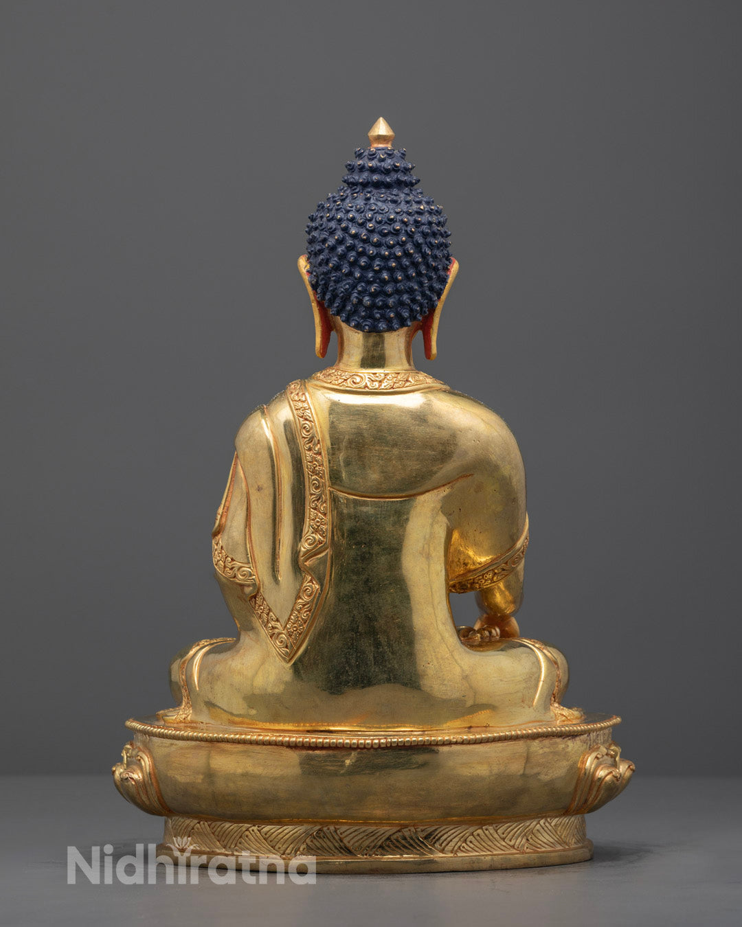 Back view showing hollow consecration chamber inside hand-carved Buddha statue.