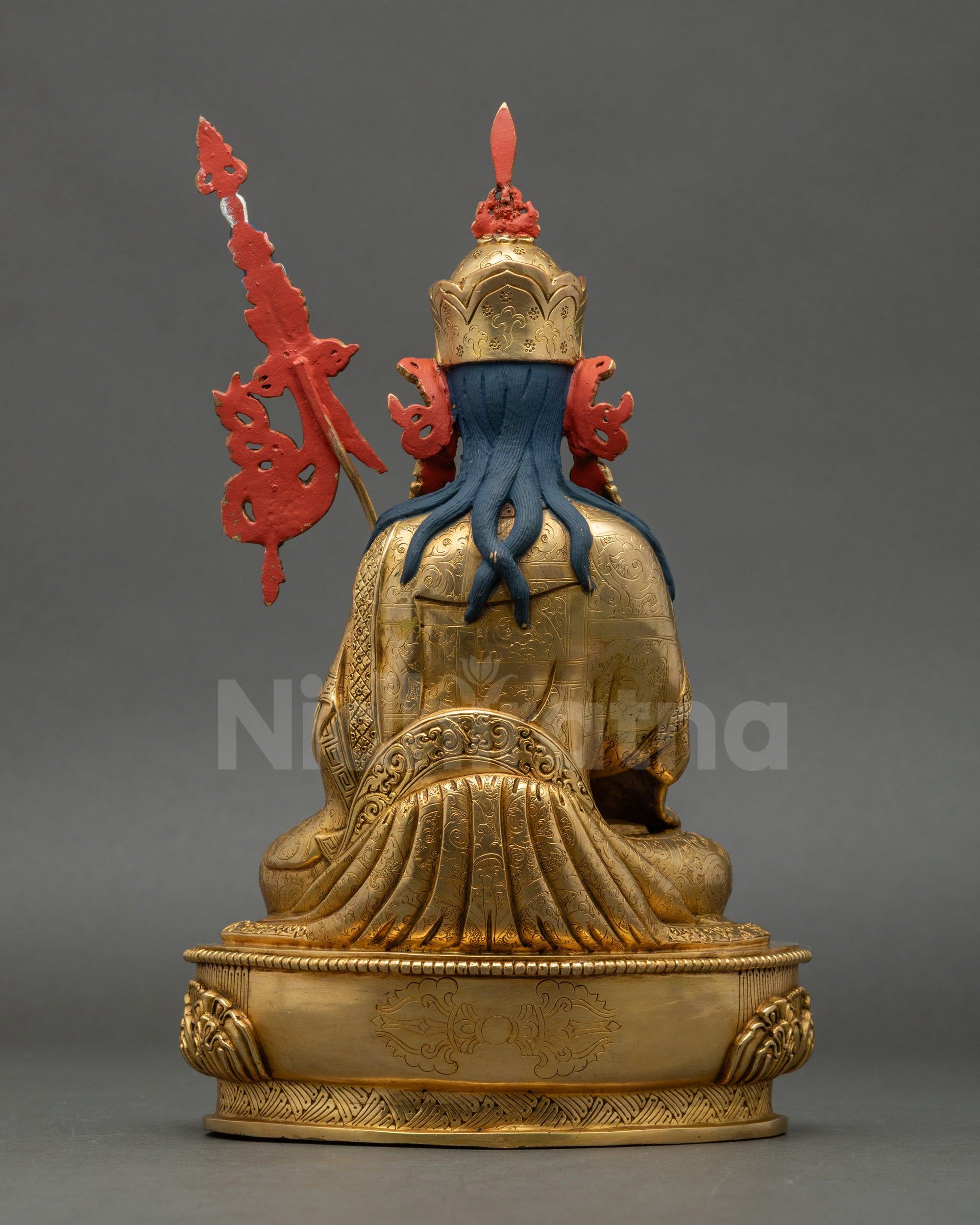 Back view showing intricate gold-gilded copper craftsmanship of Tsokye Dorje statue