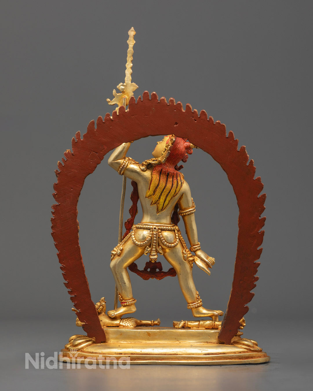 Backside of the Vajrayogini statue highlighting the detailed robe patterns and silver-finished base.