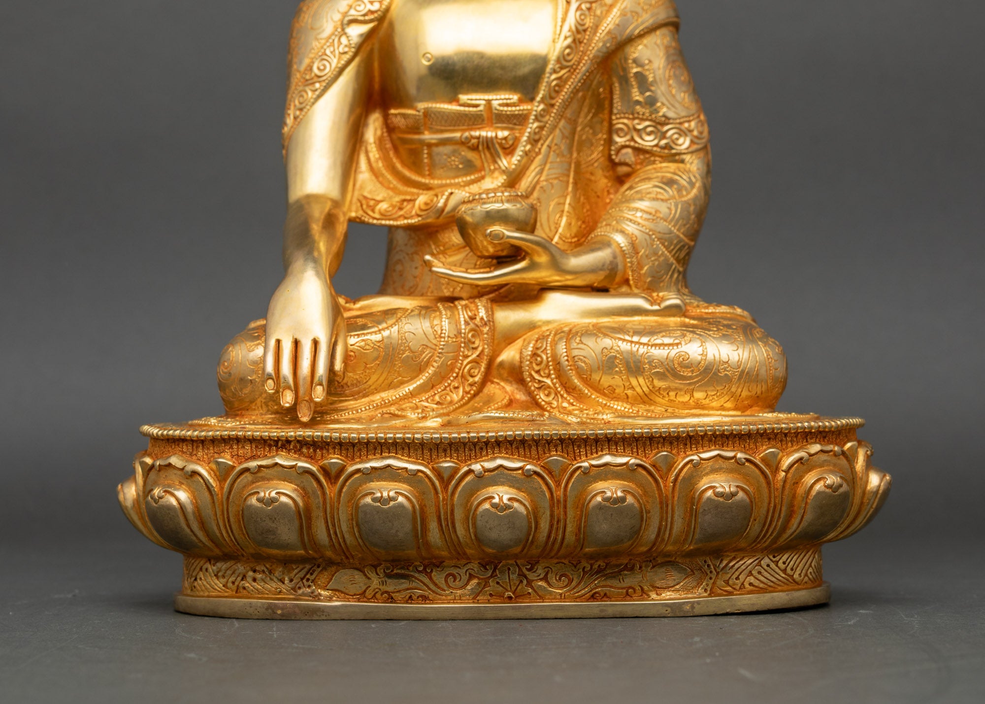 Base view Shakyamuni Buddha statue with engraved lotus disc and traditional Newari design