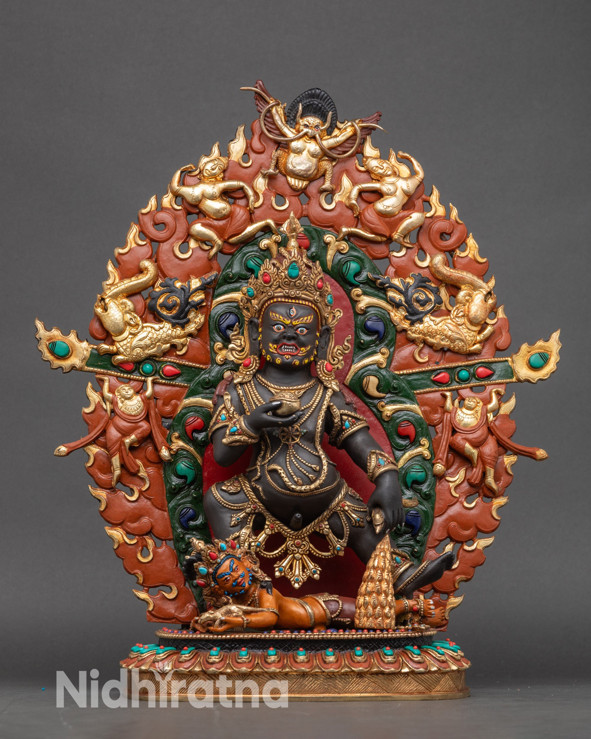 Black Dzambhala statue full view, handcrafted copper with gold-gilded finish