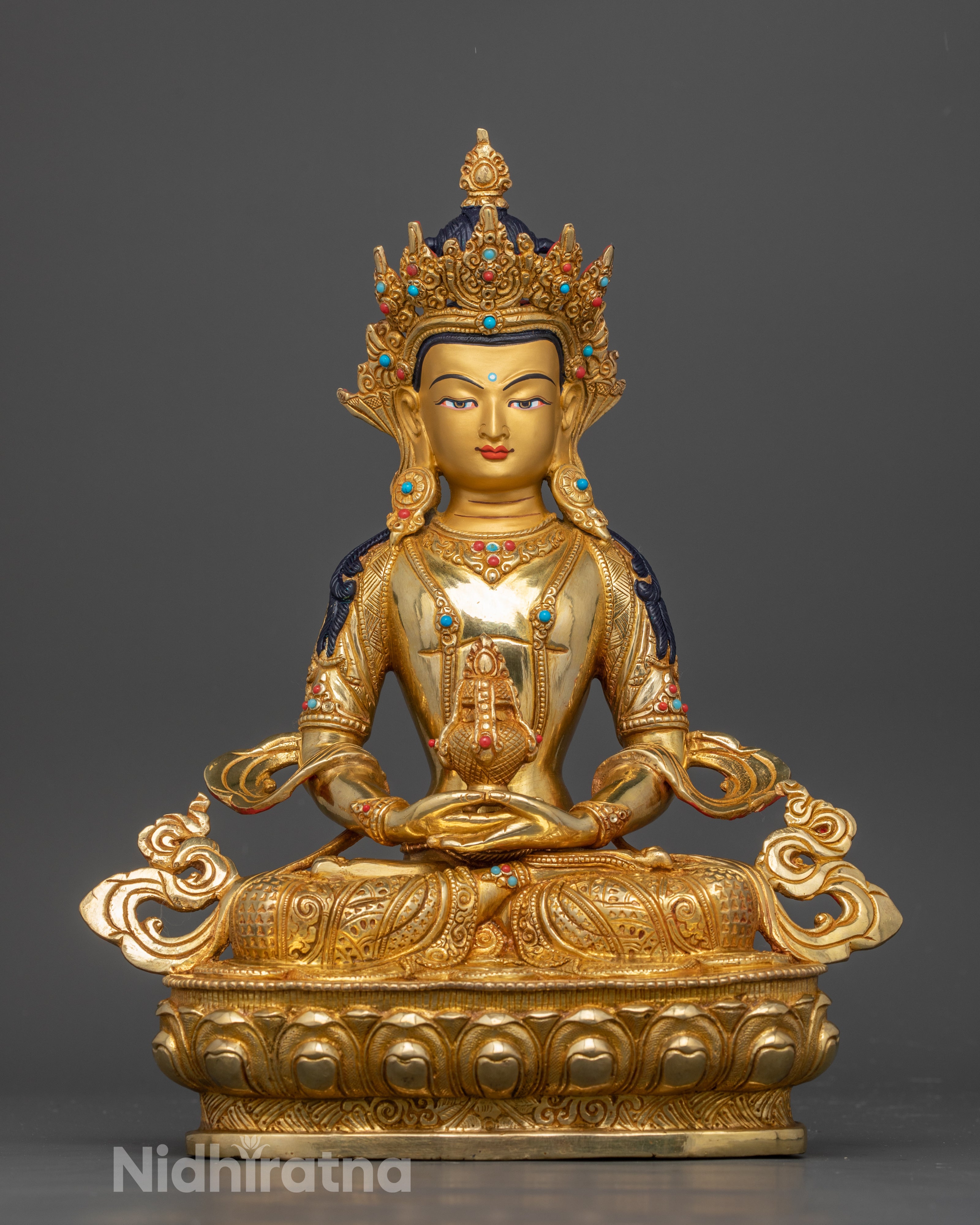 front of gold dilded Bodhisattva Amitayus statue adorned with semi precious gemstones