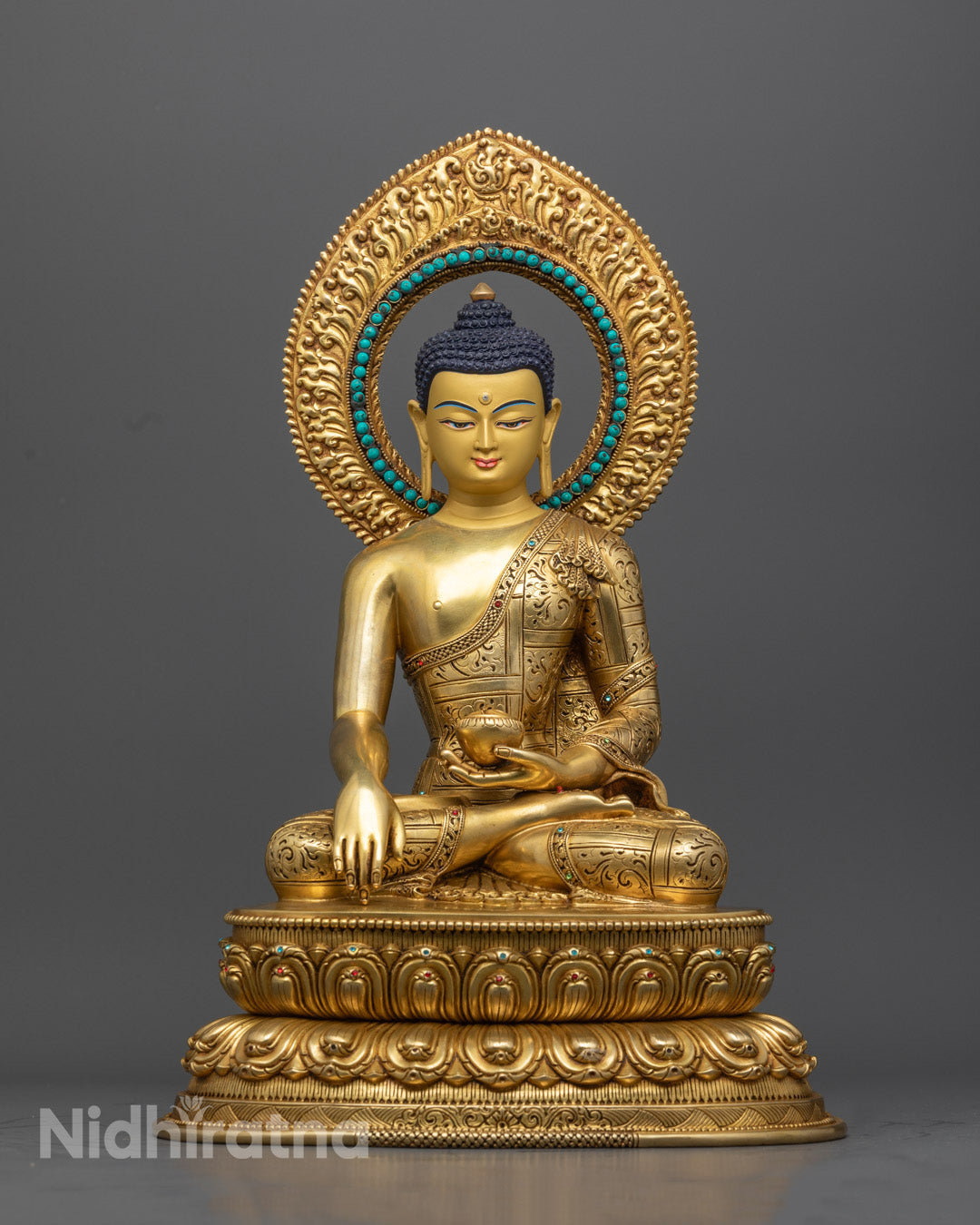 "Handcrafted copper Shakyamuni Buddha statue with turquoise gemstone inlay and Bhumisparsha mudra, made in Nepal."