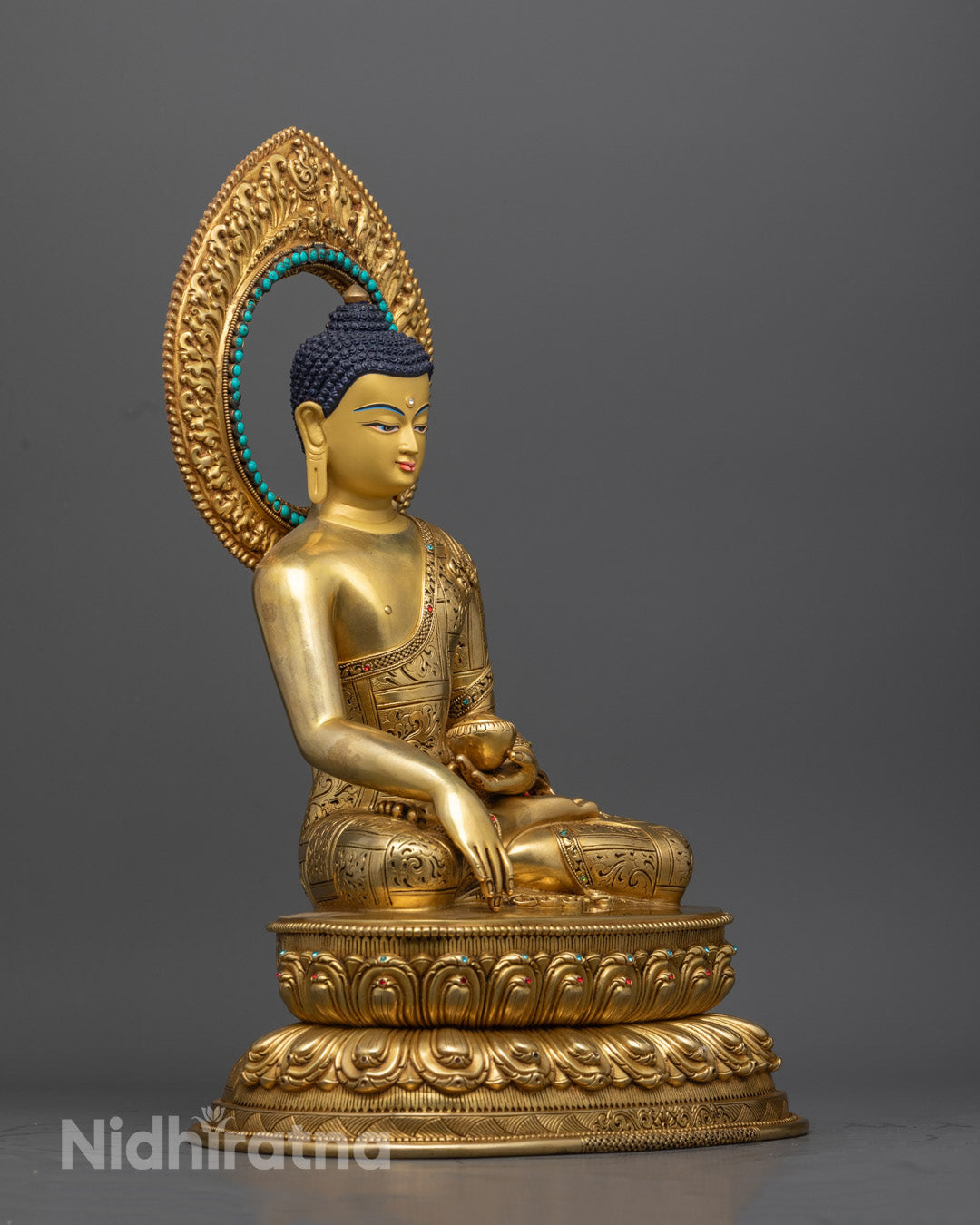 "38cm tall Nepali Buddha sculpture showing serene expression and earth-touching gesture, adorned with turquoise halo."