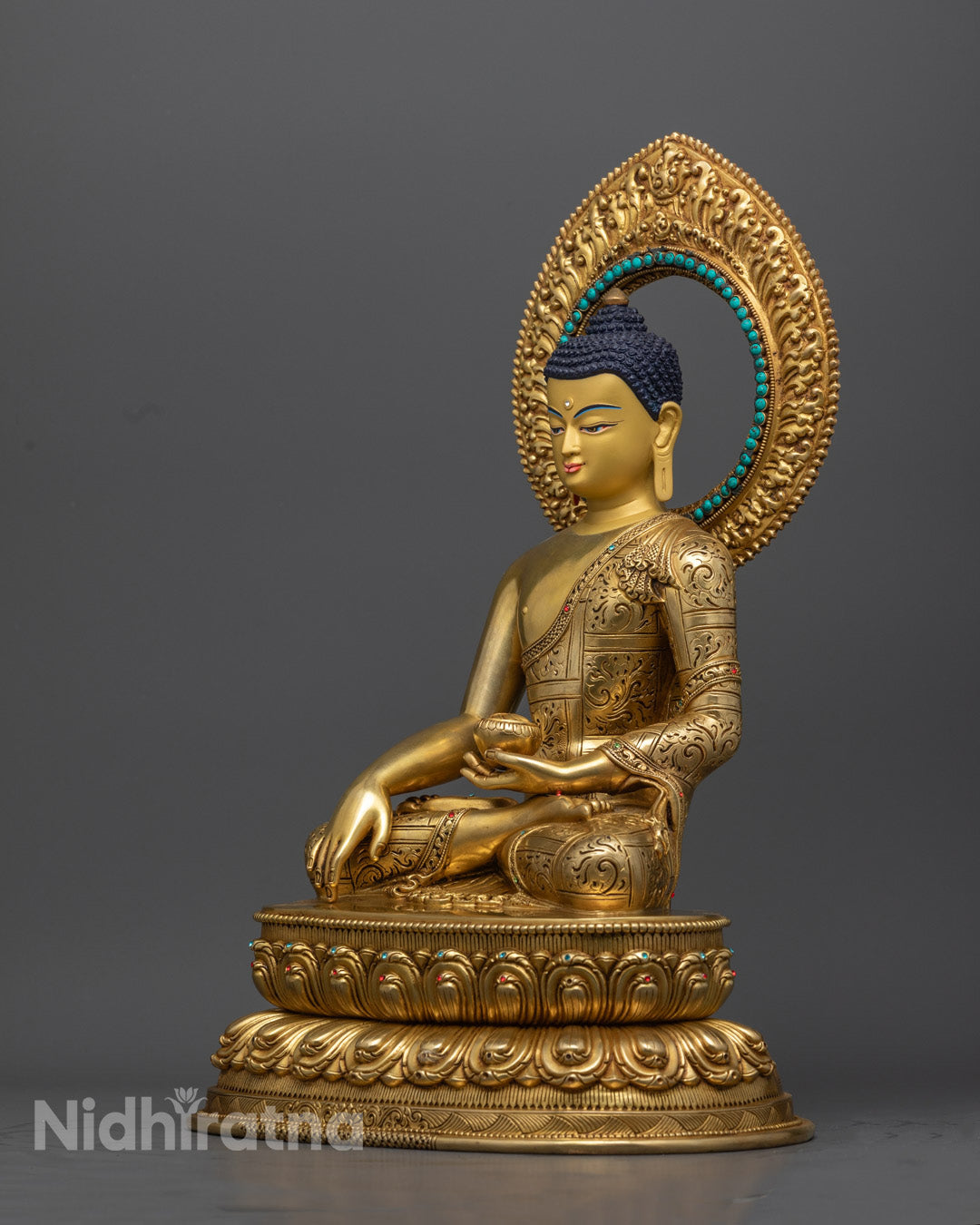 "Authentic Shakyamuni Buddha statue featuring detailed copper craftsmanship and gemstone embellishments for meditation altar."