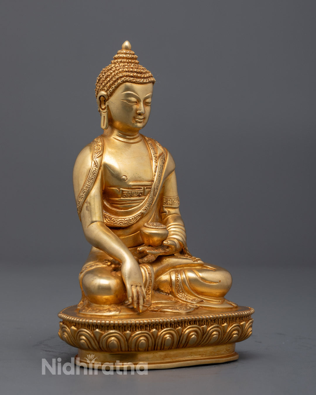 Buddha Shakyamuni’s gold-gilded face – serene expression and fine acrylic painting, symbolizing inner peace and divine spiritual presence in Tibetan art.
