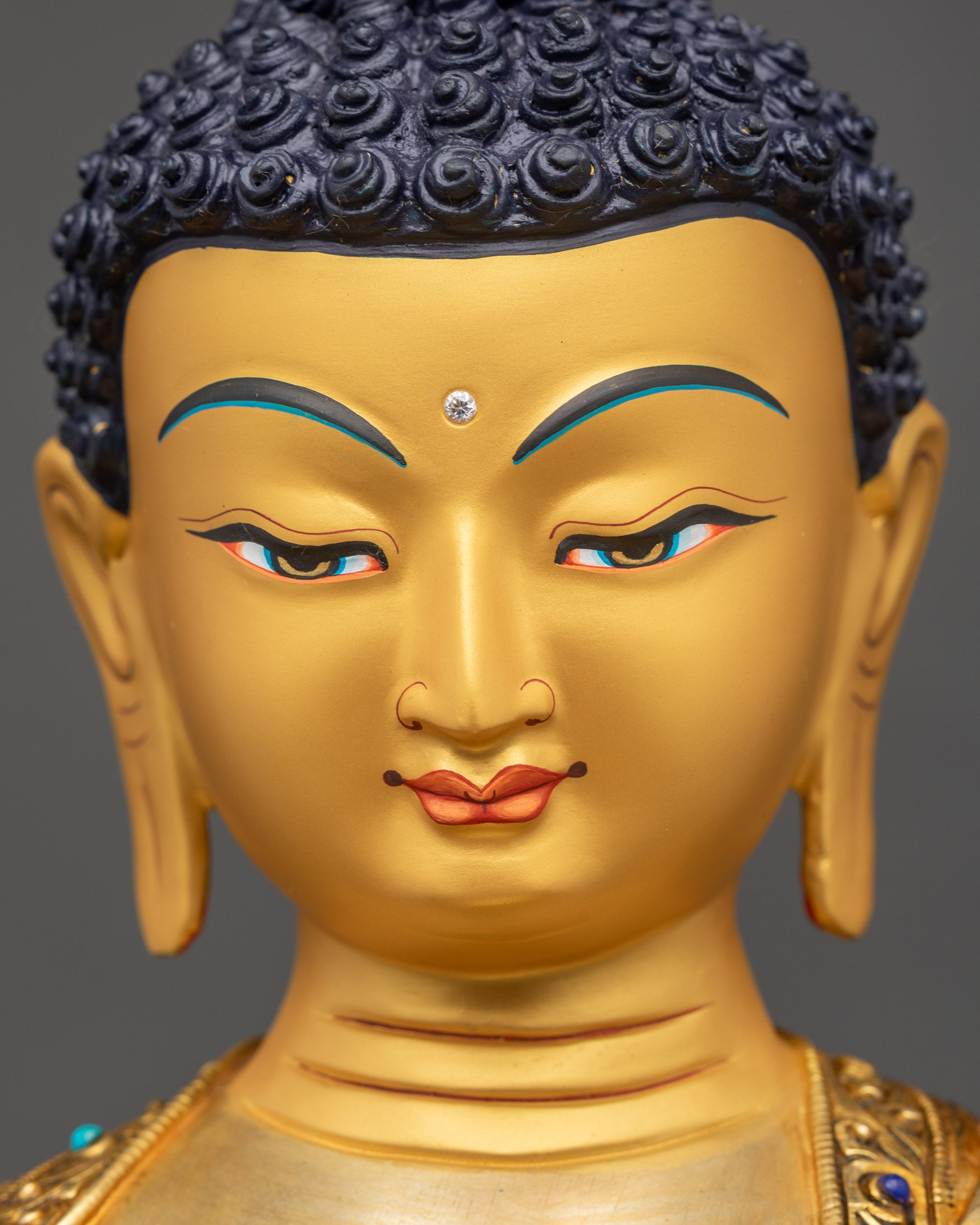 Buddha gold-gilded face detailed close up spiritual Shakyamuni idol