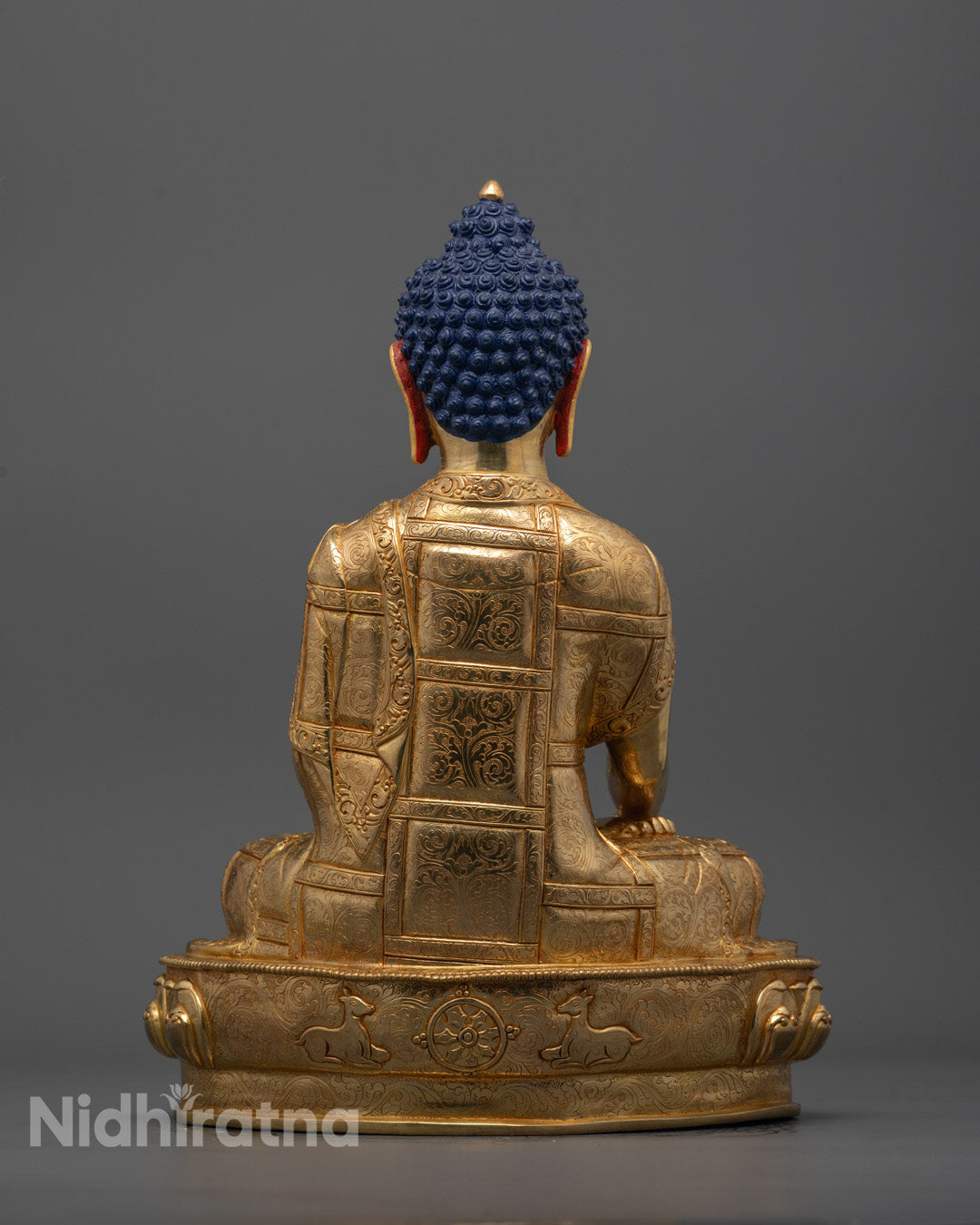 Buddha sculpture with lotus base and hollow chamber for mantra