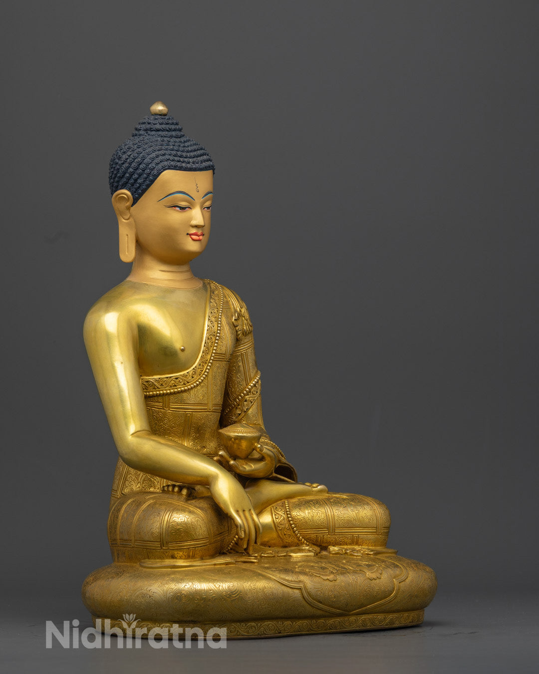 Shakyamuni Buddha statue in Bhumisparsha mudra, made from 24K gold-gilded copper with yellow body finish.