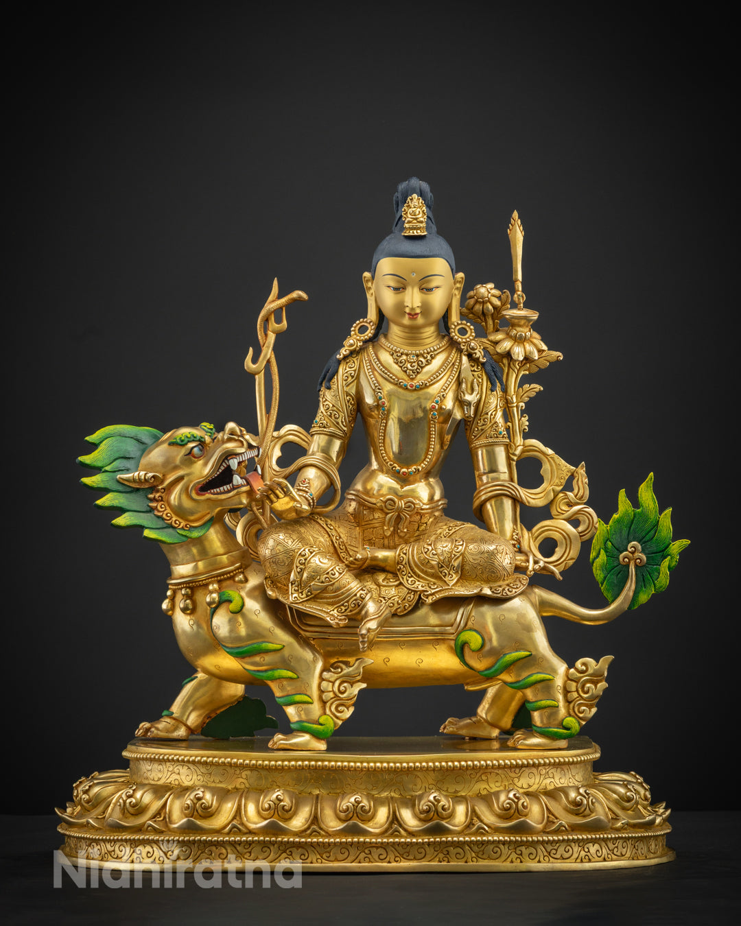 Chenrezig statue emphasizing the ornate headpiece and symmetrical arm positioning.