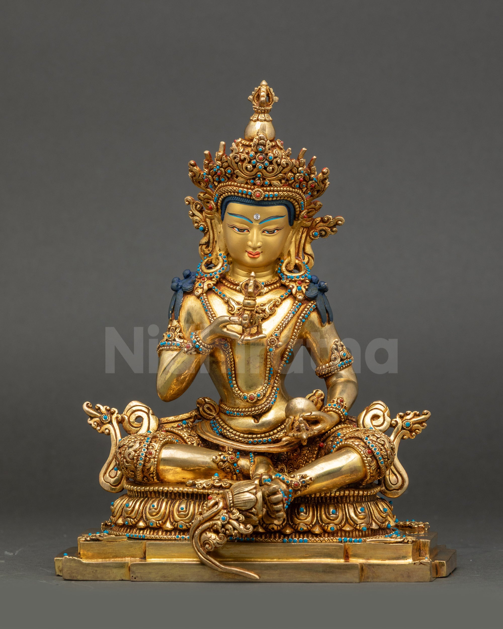Calm Vajrasattva Statue front view with serene gold-gilded face and lotus seat