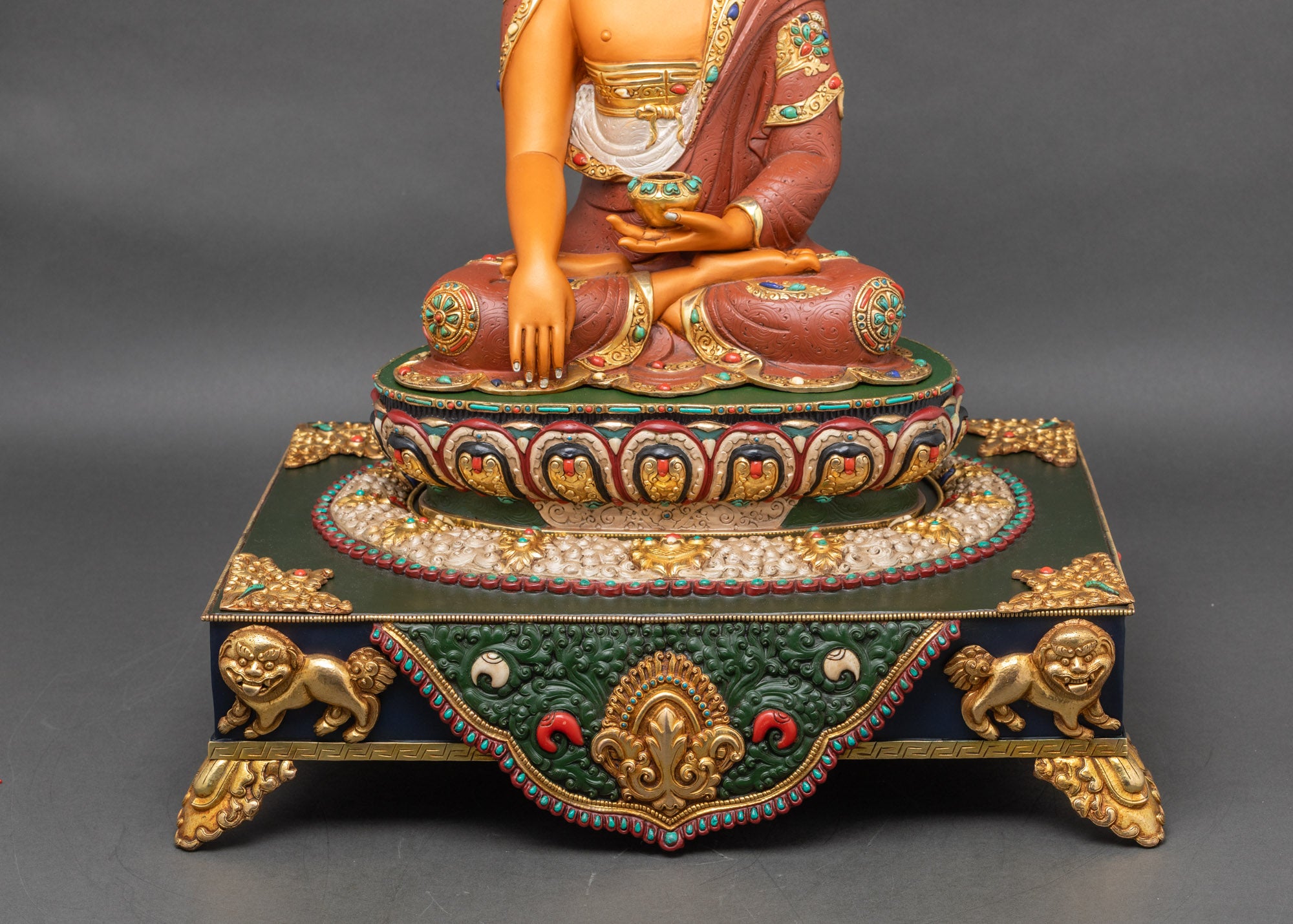 Celestial lions and heavenly elephants positioned on gilded base beneath Shakyamuni Buddha hand-painted lion throne