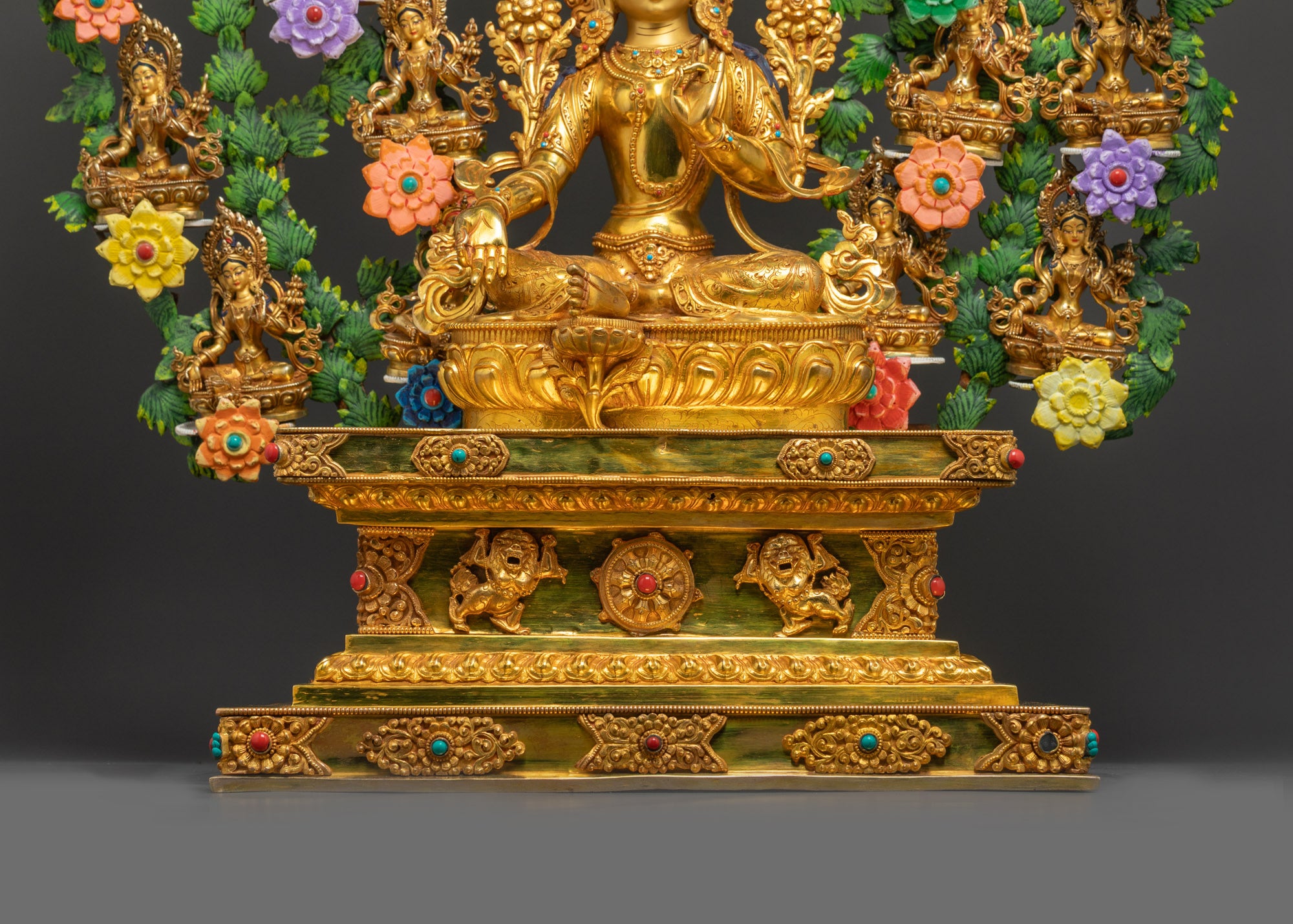 Center Green Tara Goddess seated on lotus throne with gold-gilded face and jeweled crown