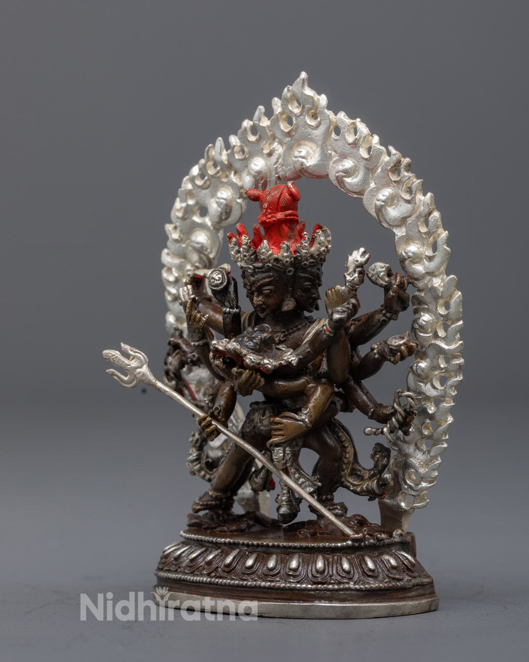 Chakrasamvara 12 armed Yidam deity statue crafted using electroplating with silver plated details and symbolic lotus base