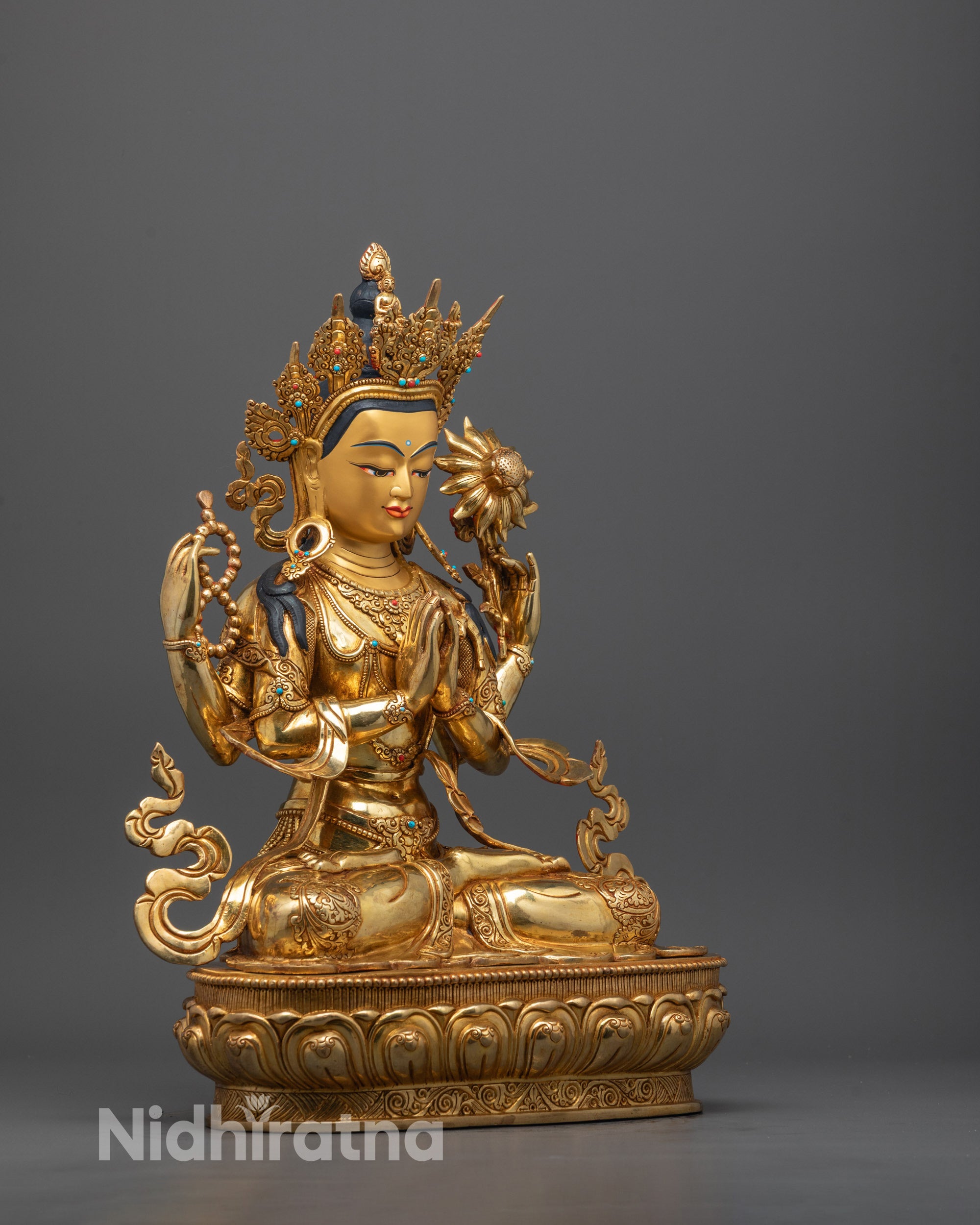 Side angle showing intricate detailing of Chenrezig’s robes, jewelry, and serene