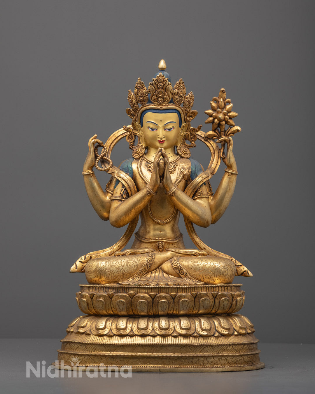 Front view of Chenrezig statue with fire-gilded body and acrylic-painted details