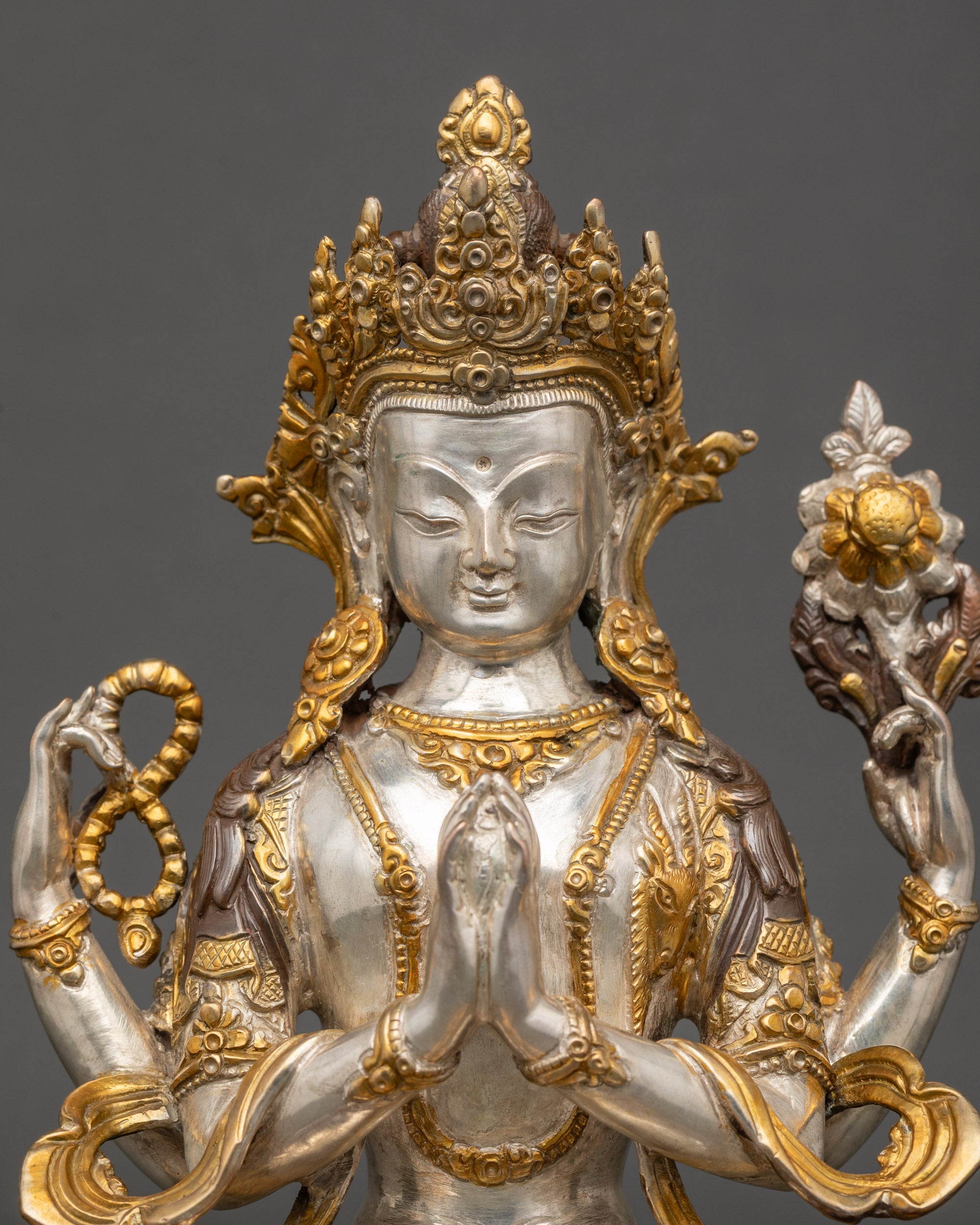 Chenrezig face gently closed eyes oxidized copper compassion deity