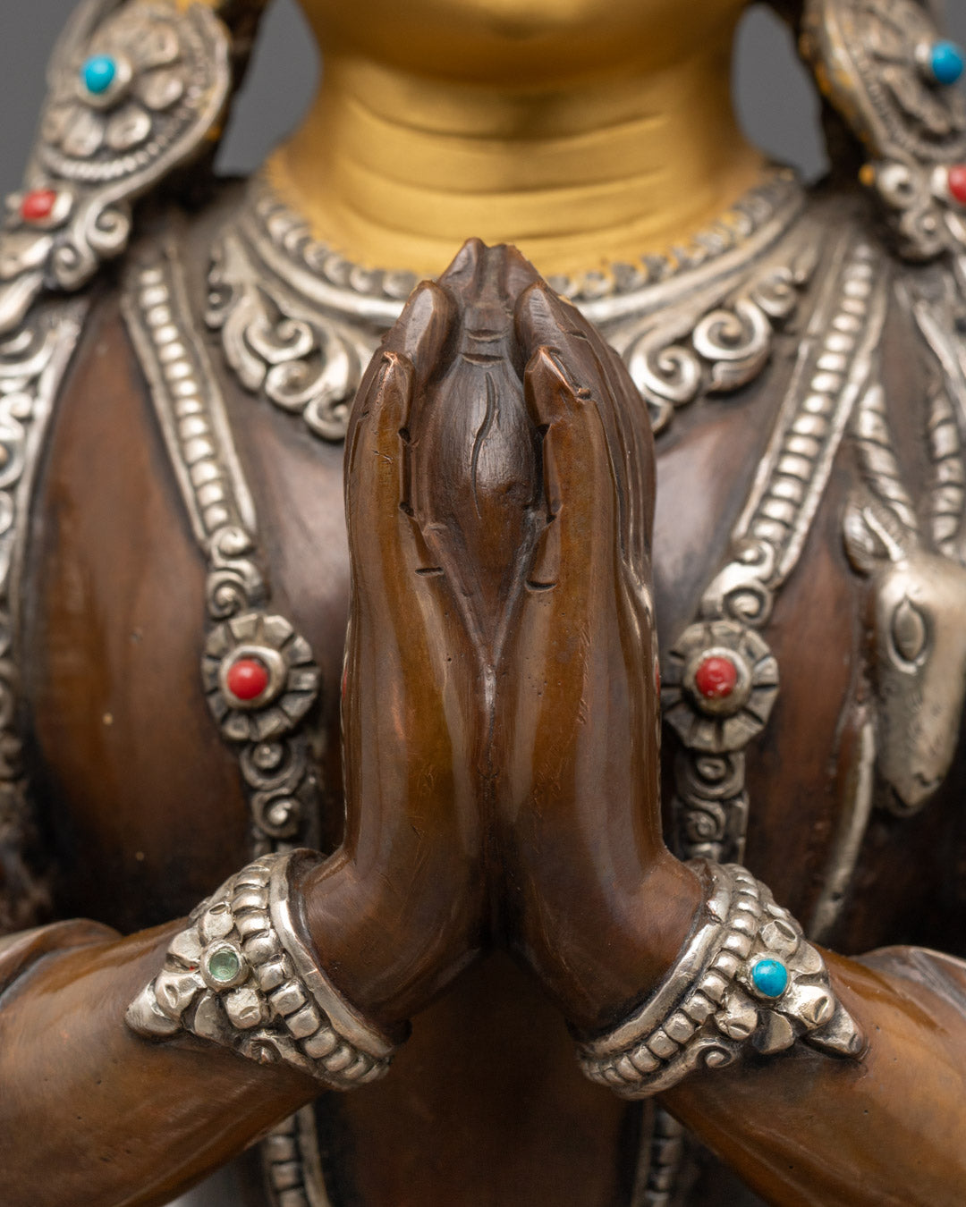 Chenrezig's compassion mudra and mantra chamber in focus, highlighting the statue's spiritual function for Buddhist meditation and prayer practices