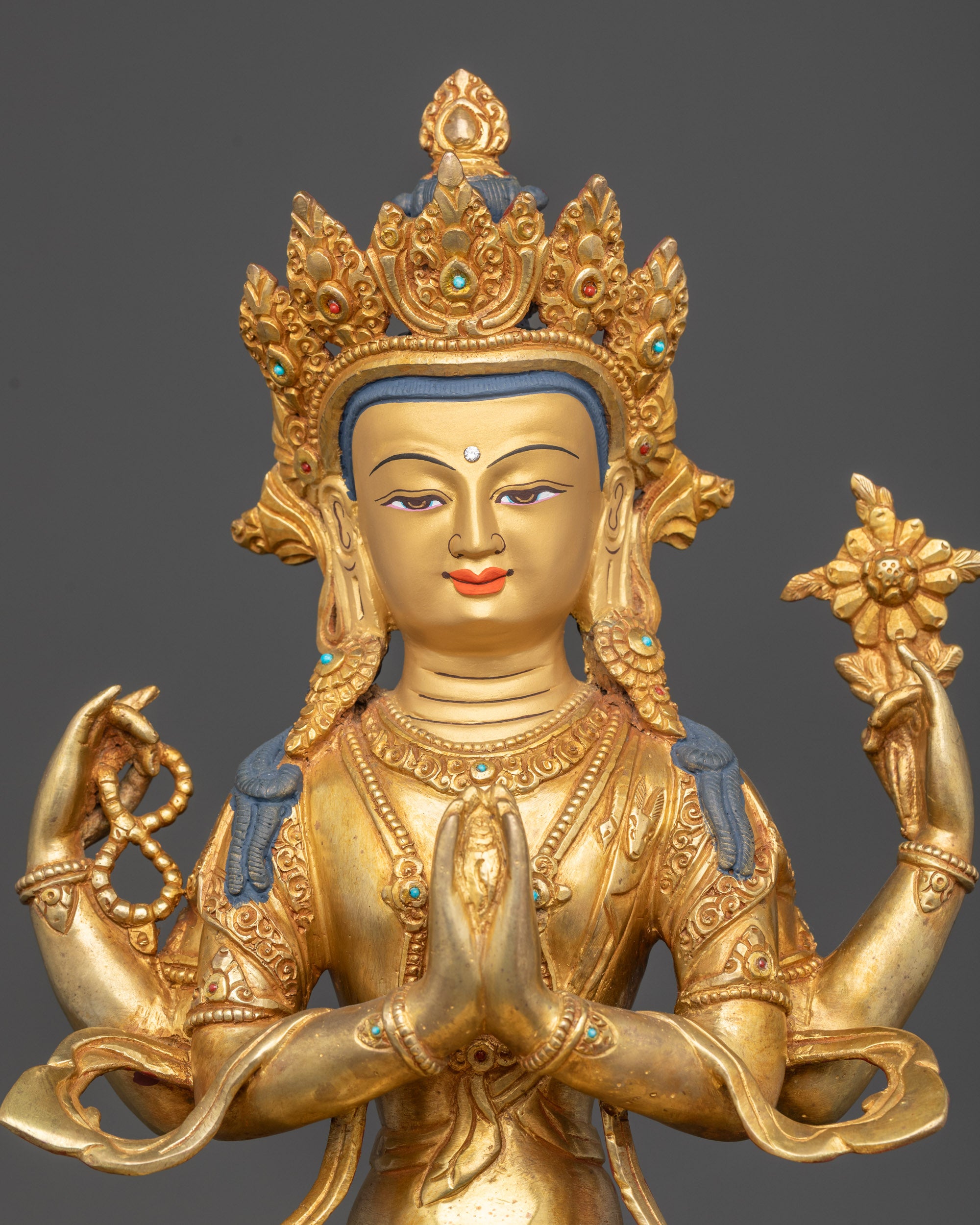Chenrezig statue regular close up four armed Avalokiteshvara lotus throne Nepal