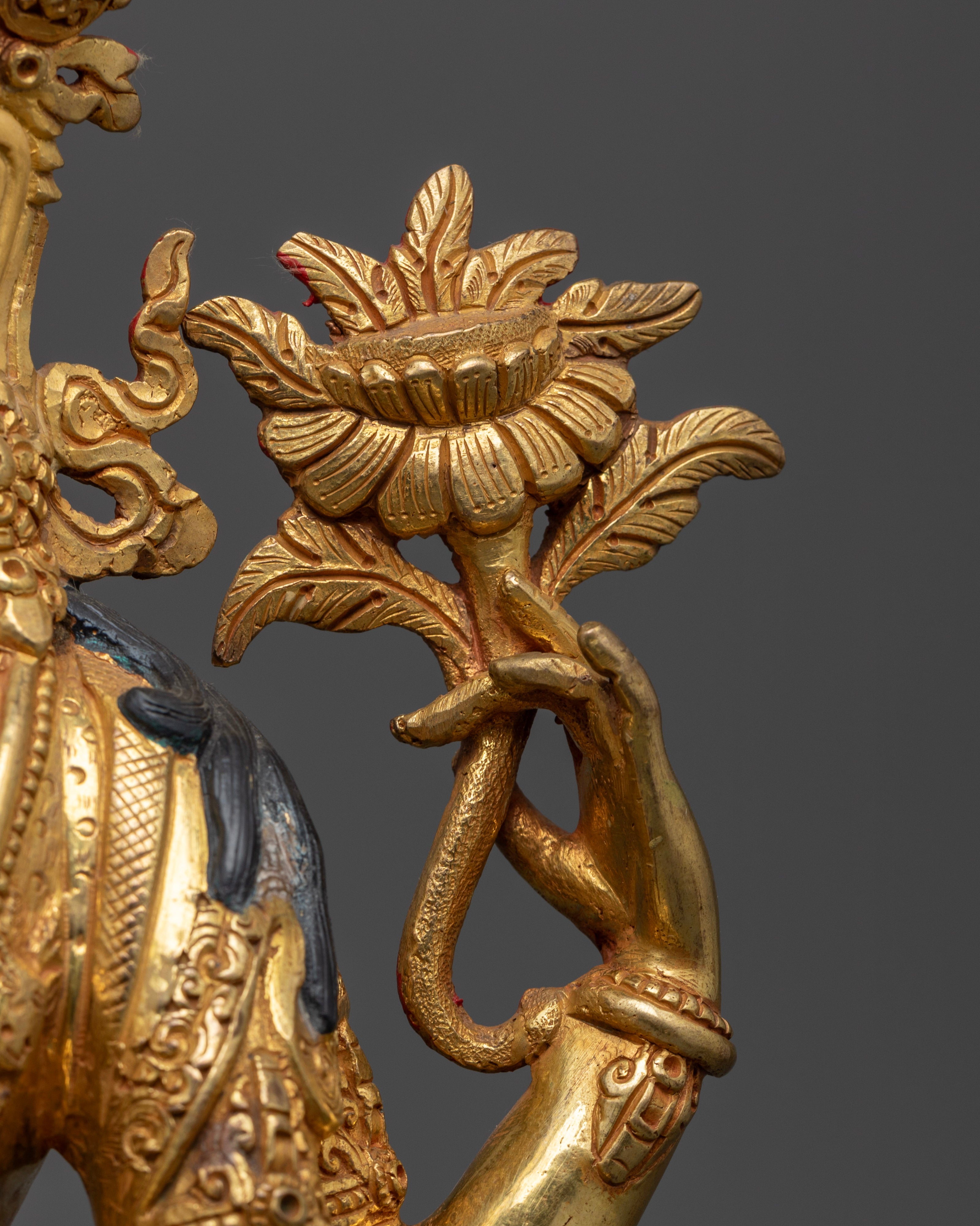 left hand of chenrezig statue holding fully bloomed lotus | Spiritual decor Avalokiteshvara | Sacred Avalokiteshvara statue