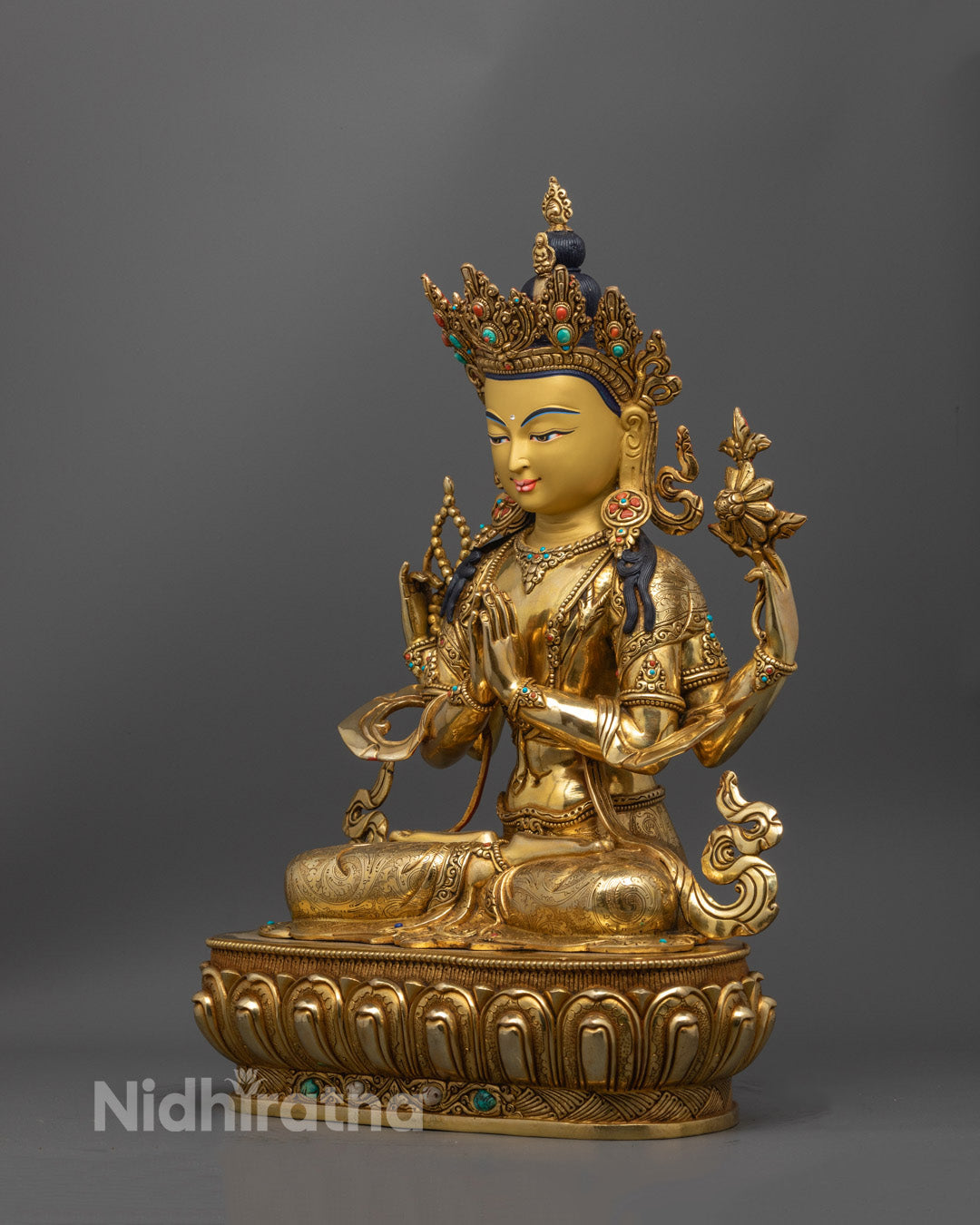Nepalese Buddha of Compassion statue highlighting the ornate base, symbolic attributes in each hand, and the spiritual aura of the piece