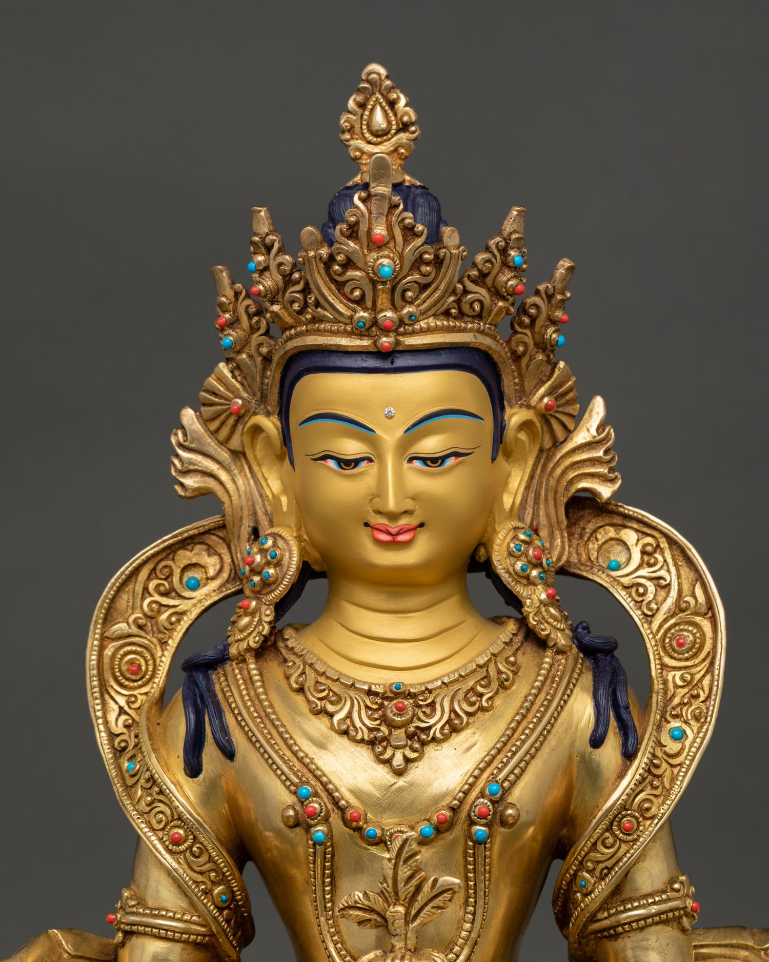 close-up of Amitayus face with gold-painted features and five-jeweled crown