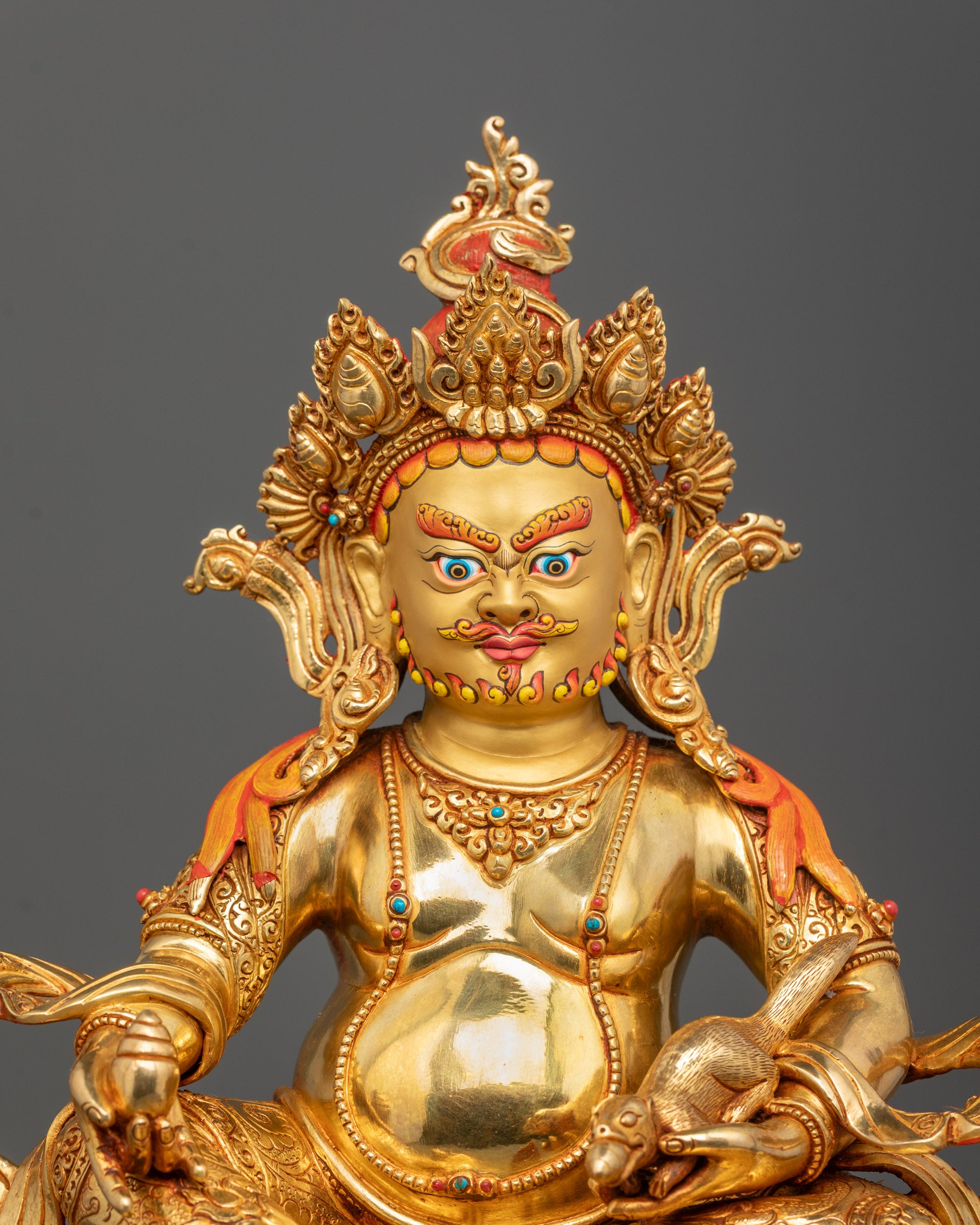 Close-Up of Dzambhala Face with 24k Gold Fire Gilding and Intricate Lost Wax Detailing