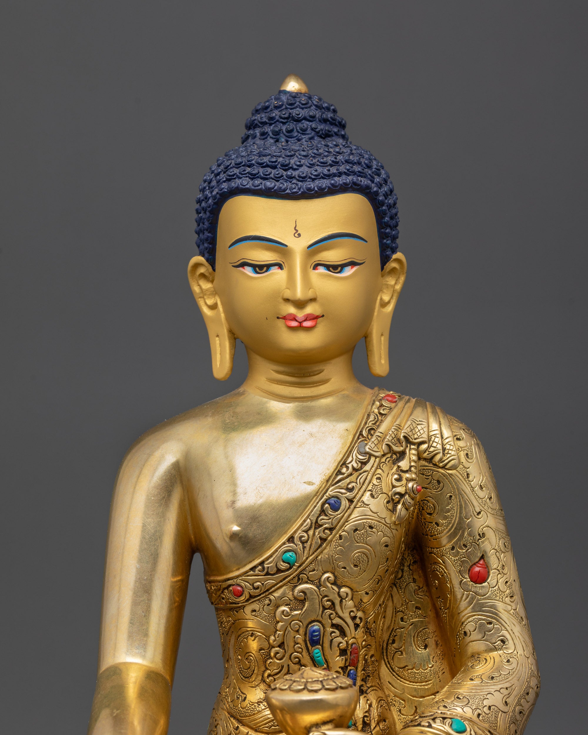 Close-Up of Serene Gold-Gilded Face of Shakyamuni Gotama Buddha Sculpture
