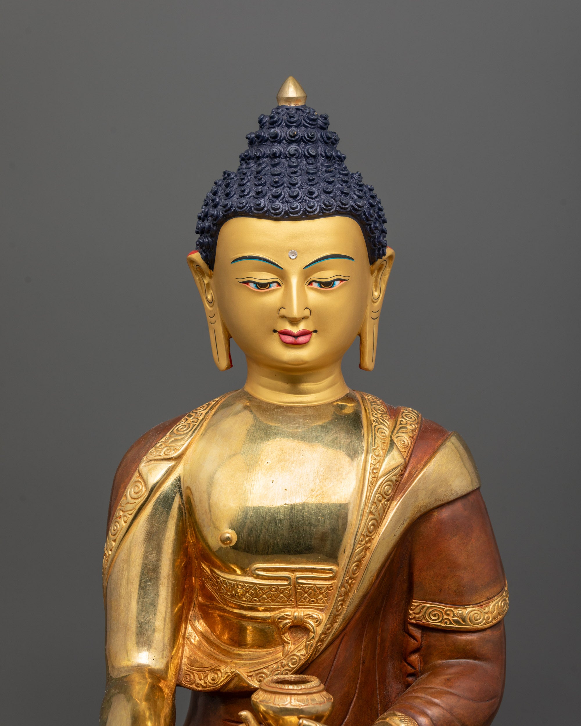 Close-Up of Shakyamuni Buddha Face with 24K Gold Gilding and Serene Expression