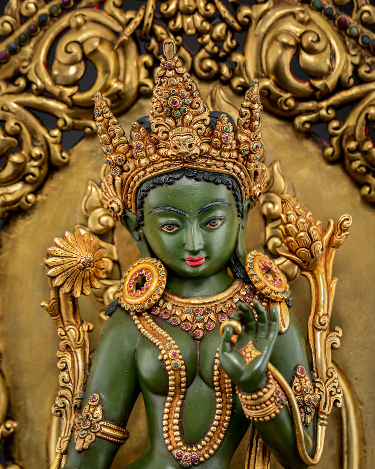 Close up Green Tara statue Nepali Buddhist copper sculpture