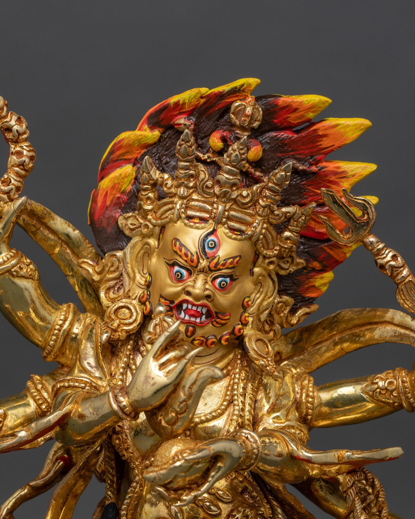 Close up Six-Armed Mahakala face third eye gold painted wrathful deity spiritual insight