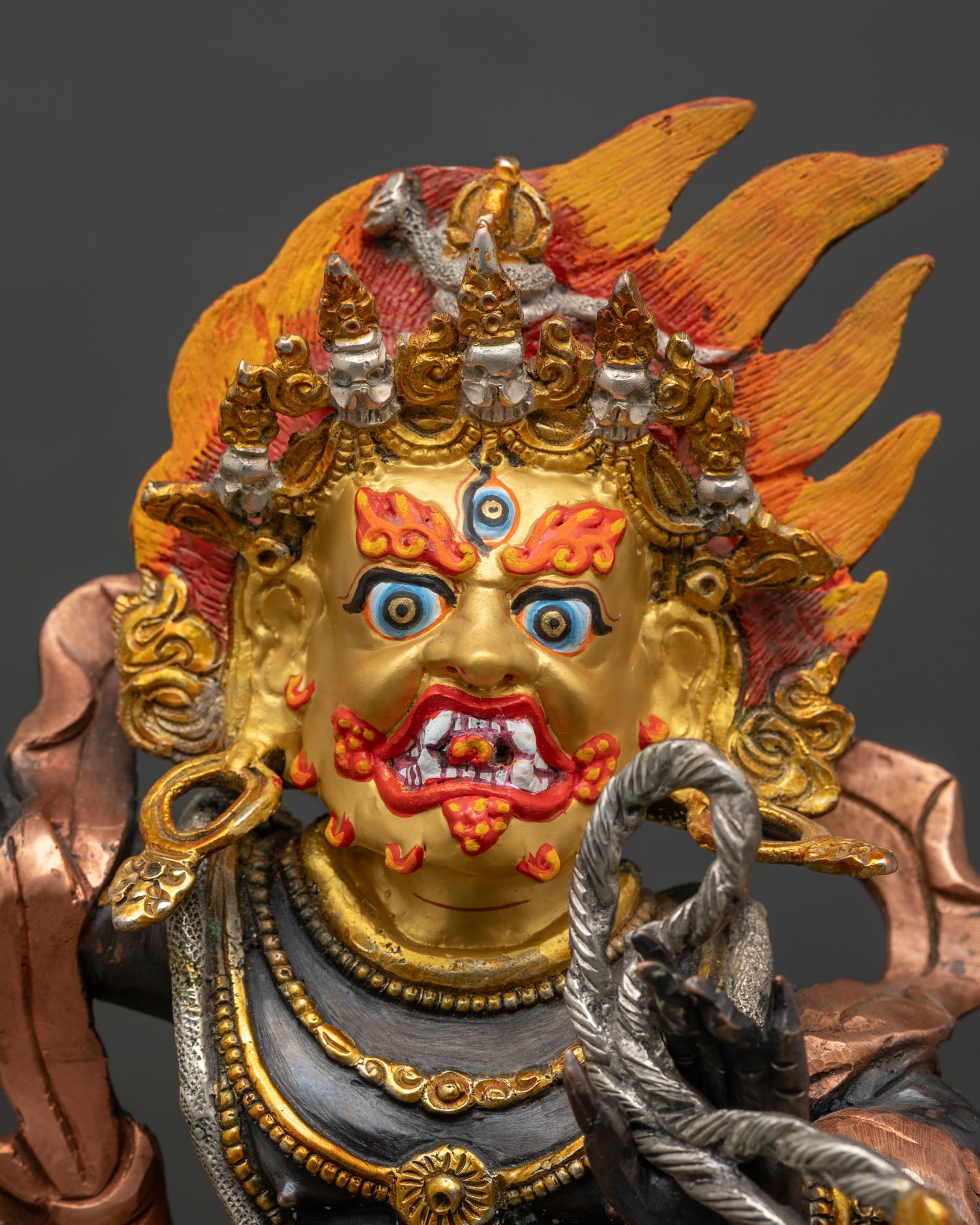 Close up Vajrapani statue hand painted acrylic colors copper Himalayan sculpture