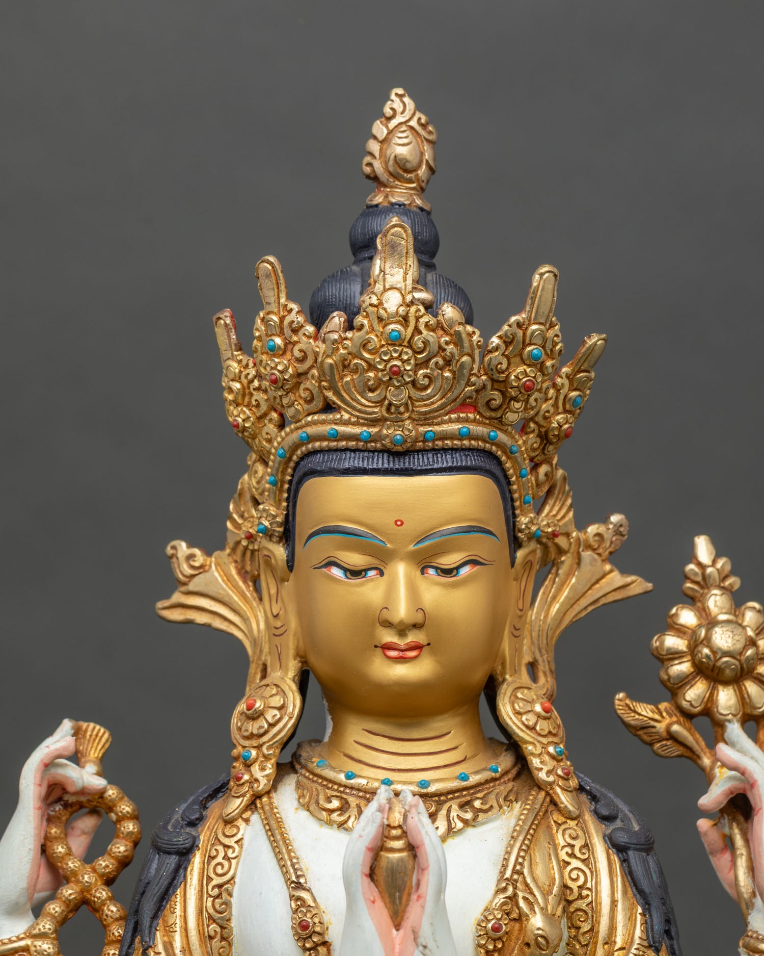 Close-up of Chenrezig hands in Anjali-Mudra, holding a wish-fulfilling-gem and crystal-mala
