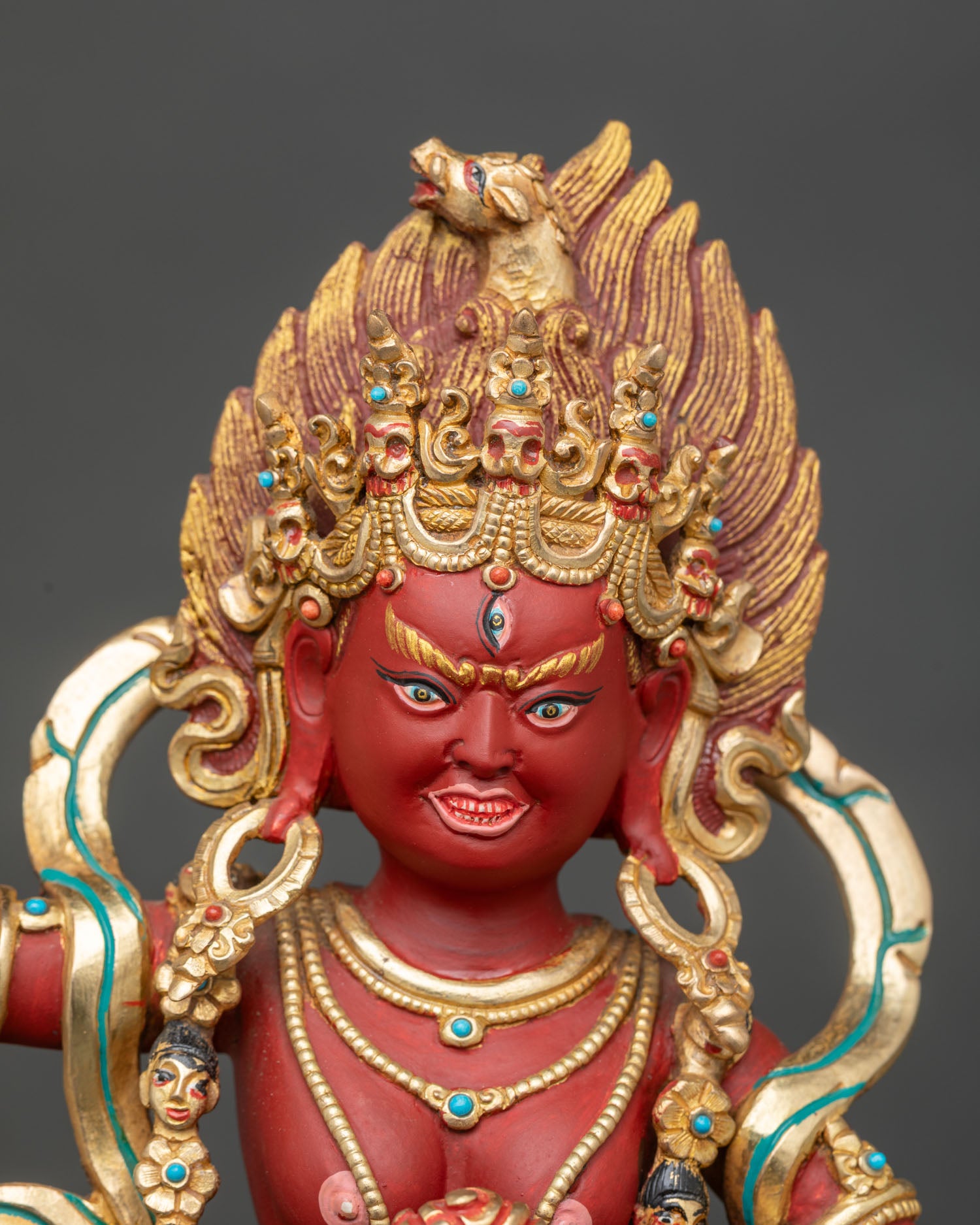Close up of Dorje Phagmo Statue gold gilded face skull cup curved knife sacred Buddhist deity