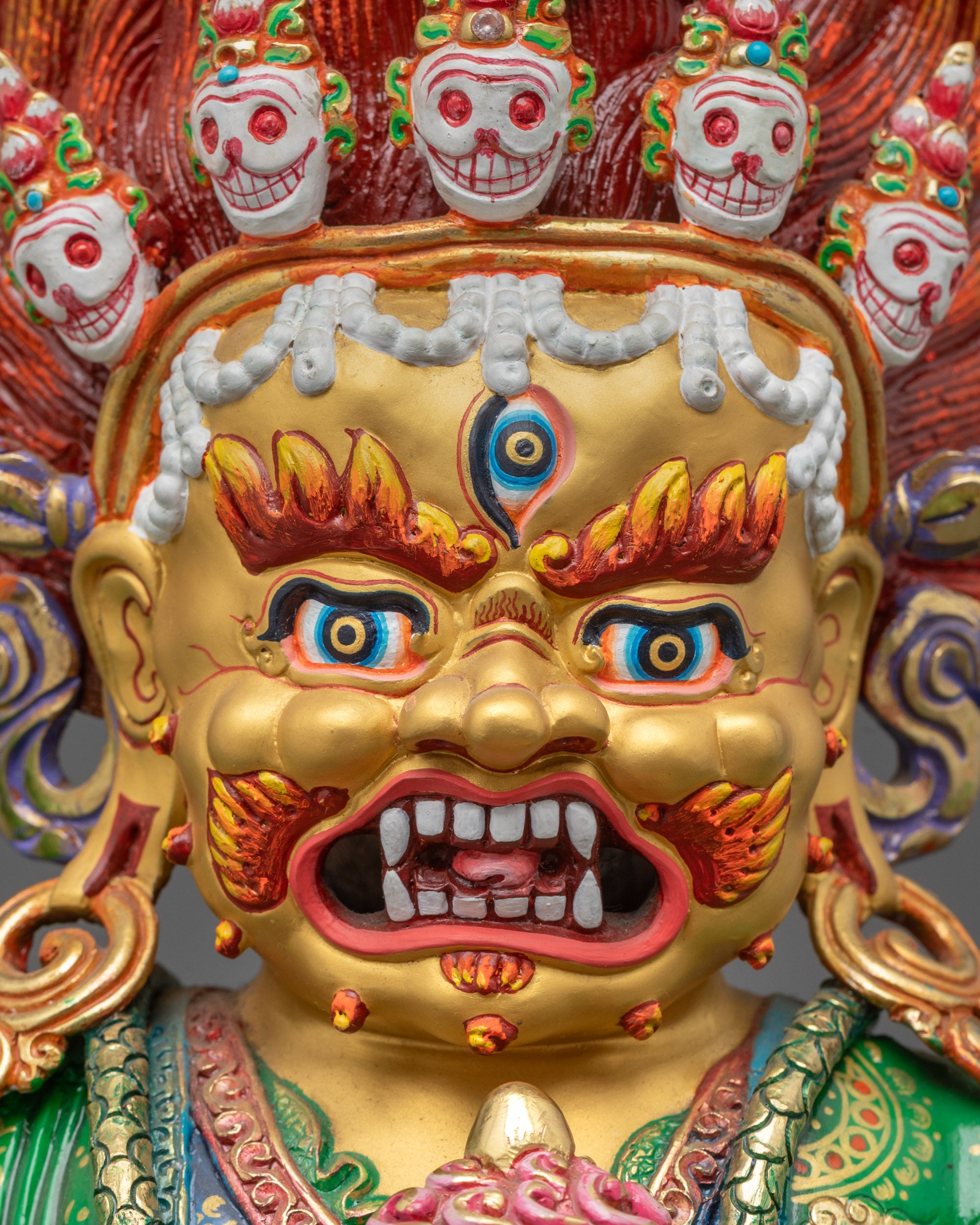 Close-up Mahakala Bernagchen face with third eye and flaying knife in hand